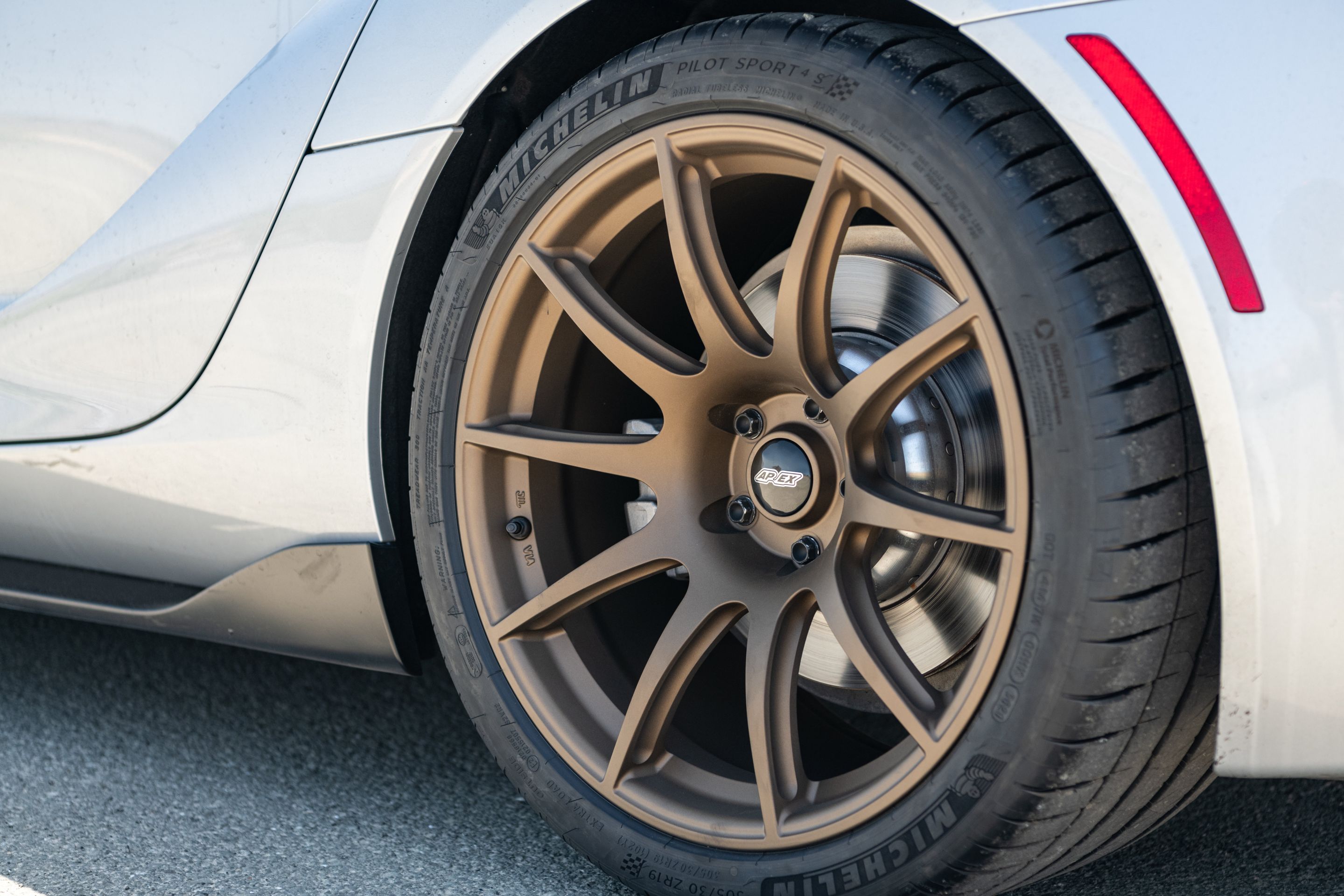 Silver Toyota GR Supra with 19" SM-10 Apex wheels in Satin Bronze