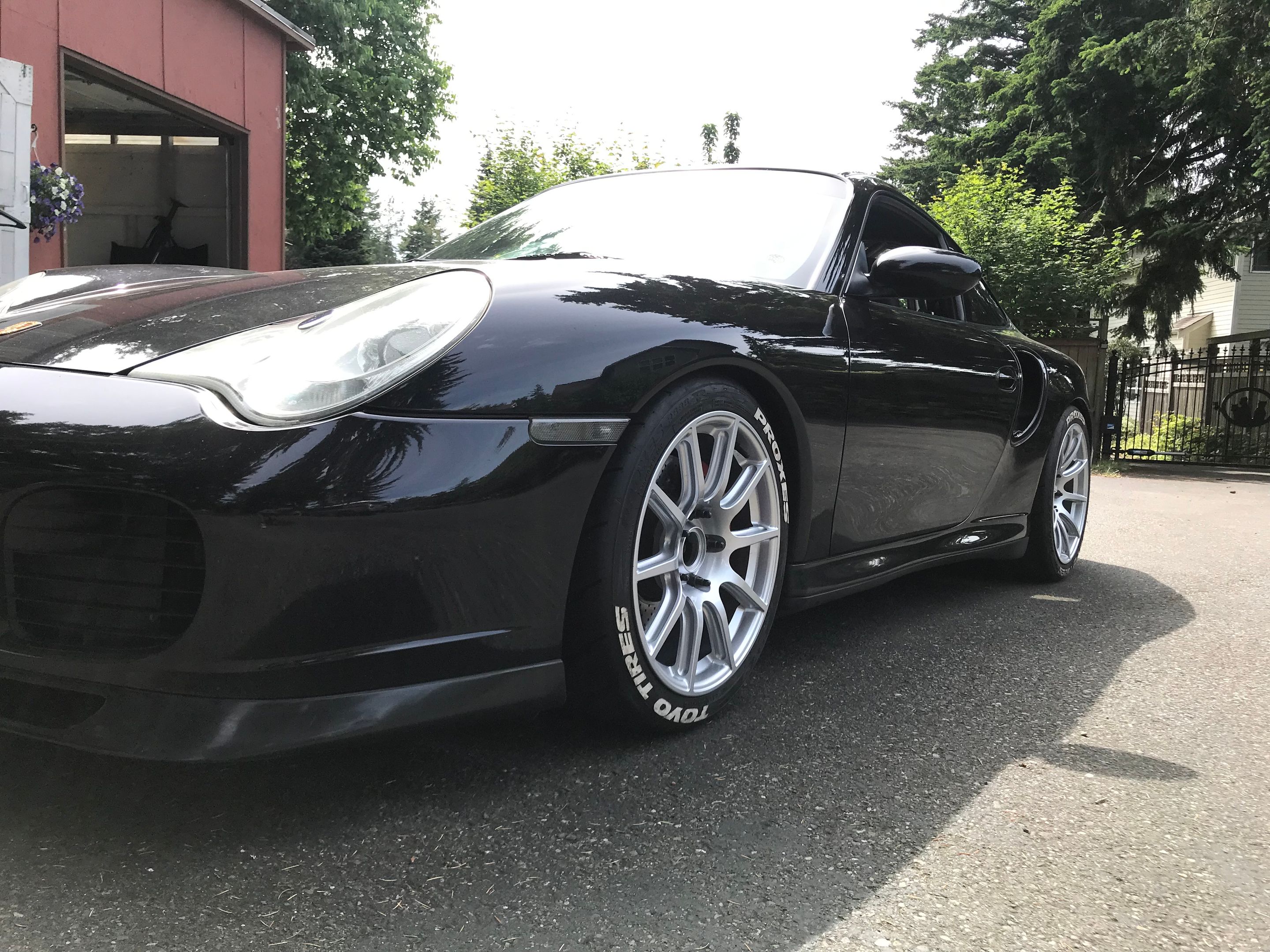 Black Porsche 911 996 Turbo with 18" SM-10 Apex wheels in Race Silver
