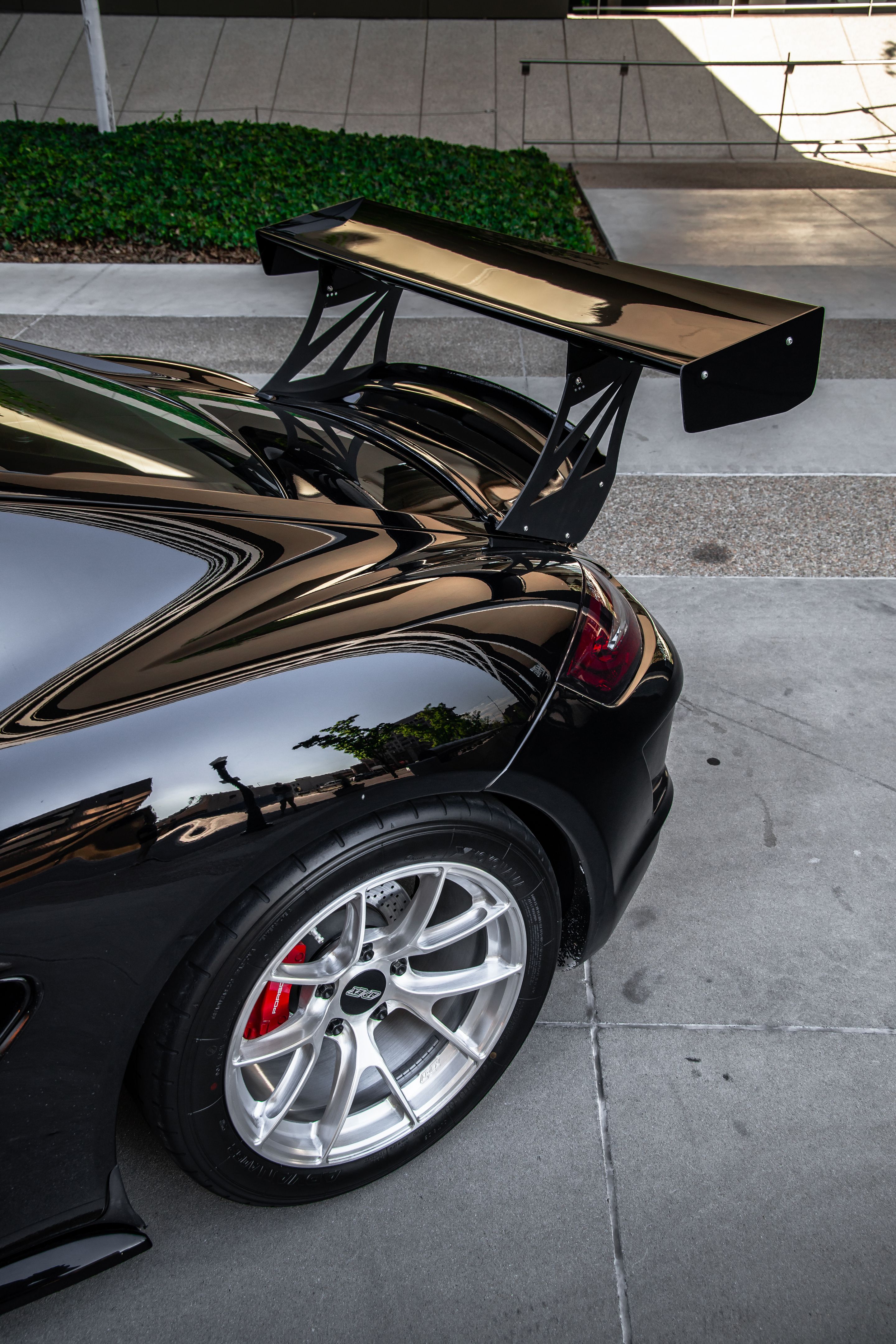 Black Porsche 987 Cayman S with 18" VS-5RS Apex wheels in Brushed Clear