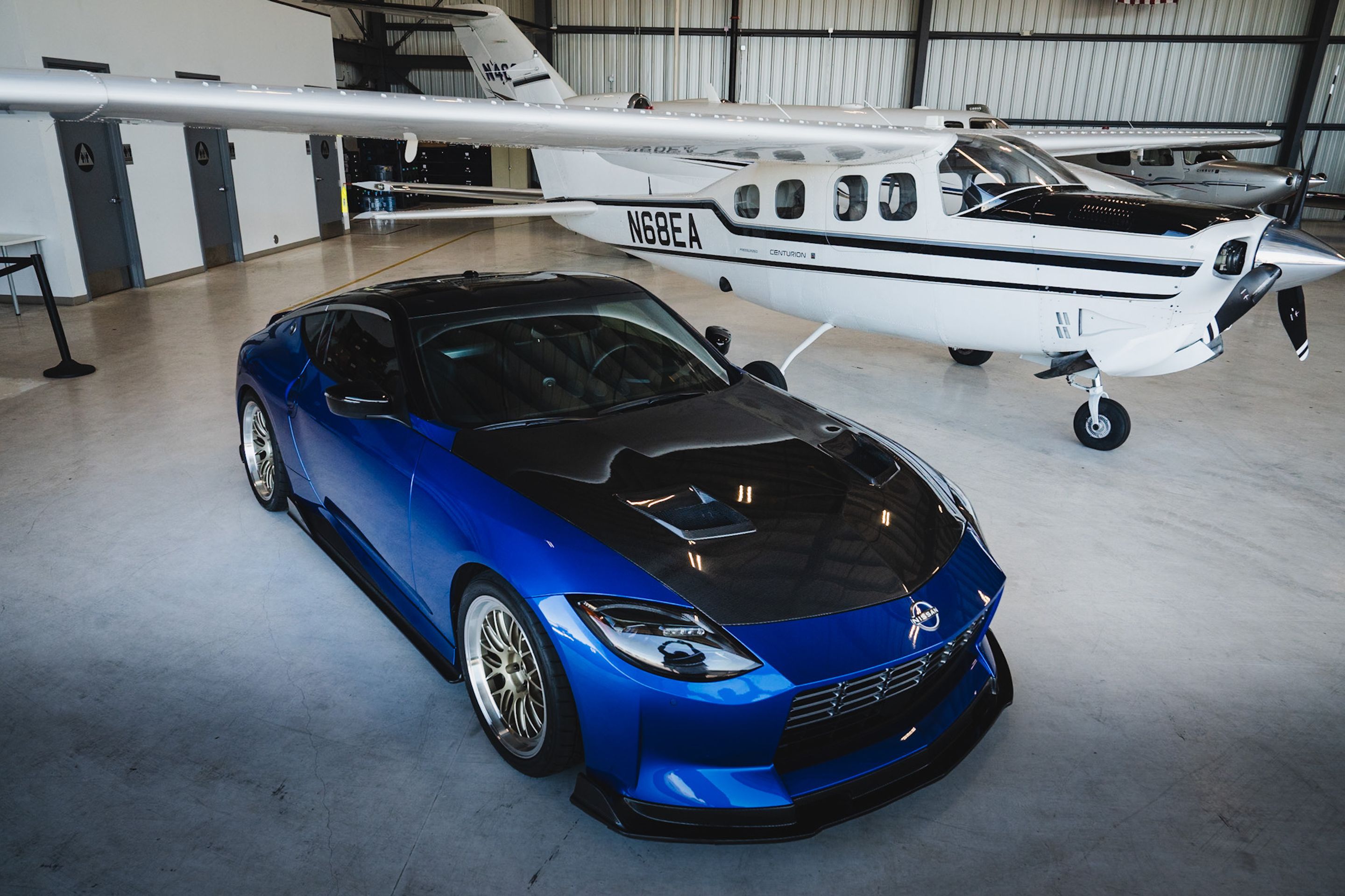 Blue Nissan Z with 19" ML-10RT Apex wheels in Machined Lip Gloss Motorsport Gold