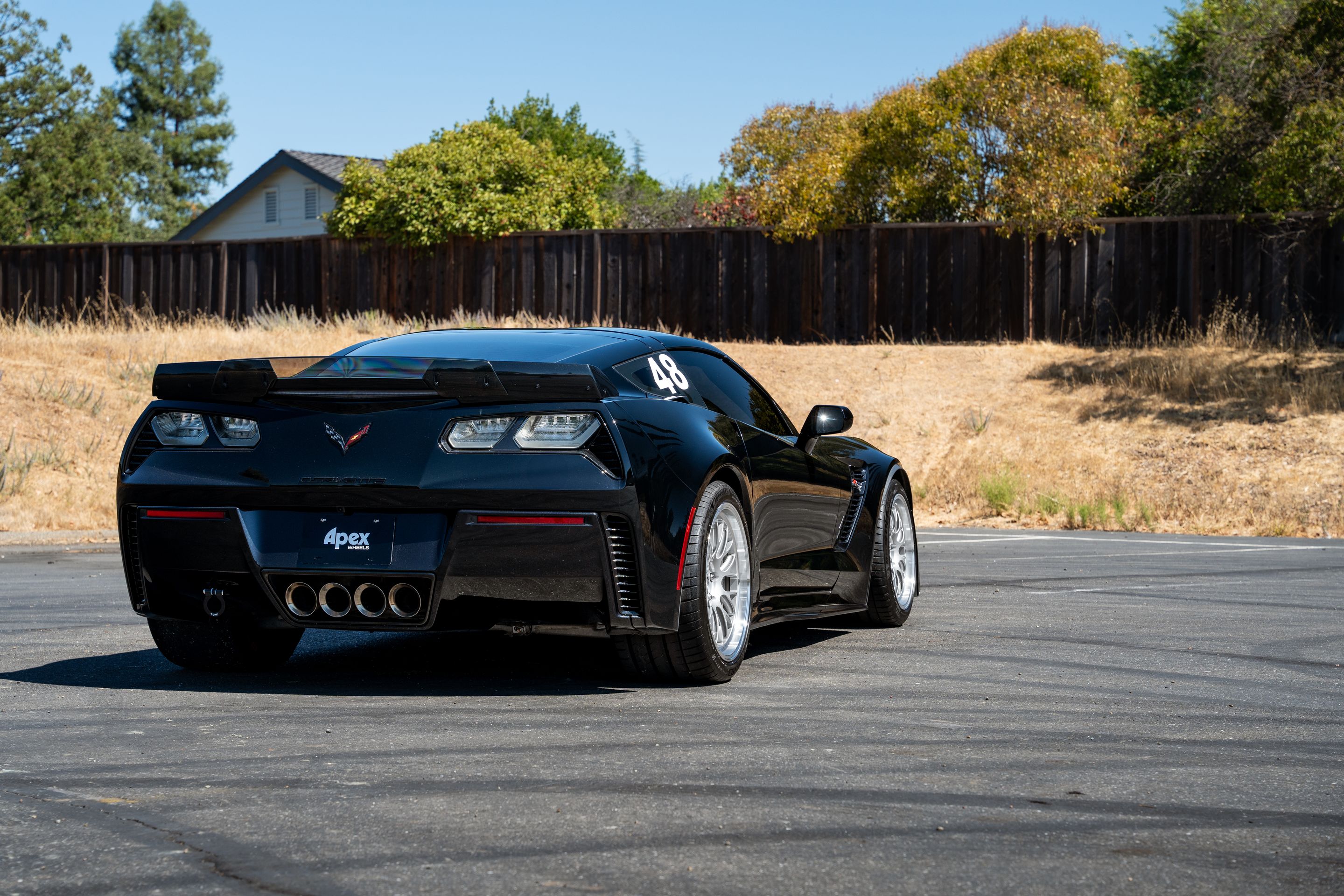 Black Chevrolet C7 Corvette Z06 with 18"/19" ML-10RT Apex wheels in Machined Lip Race Silver