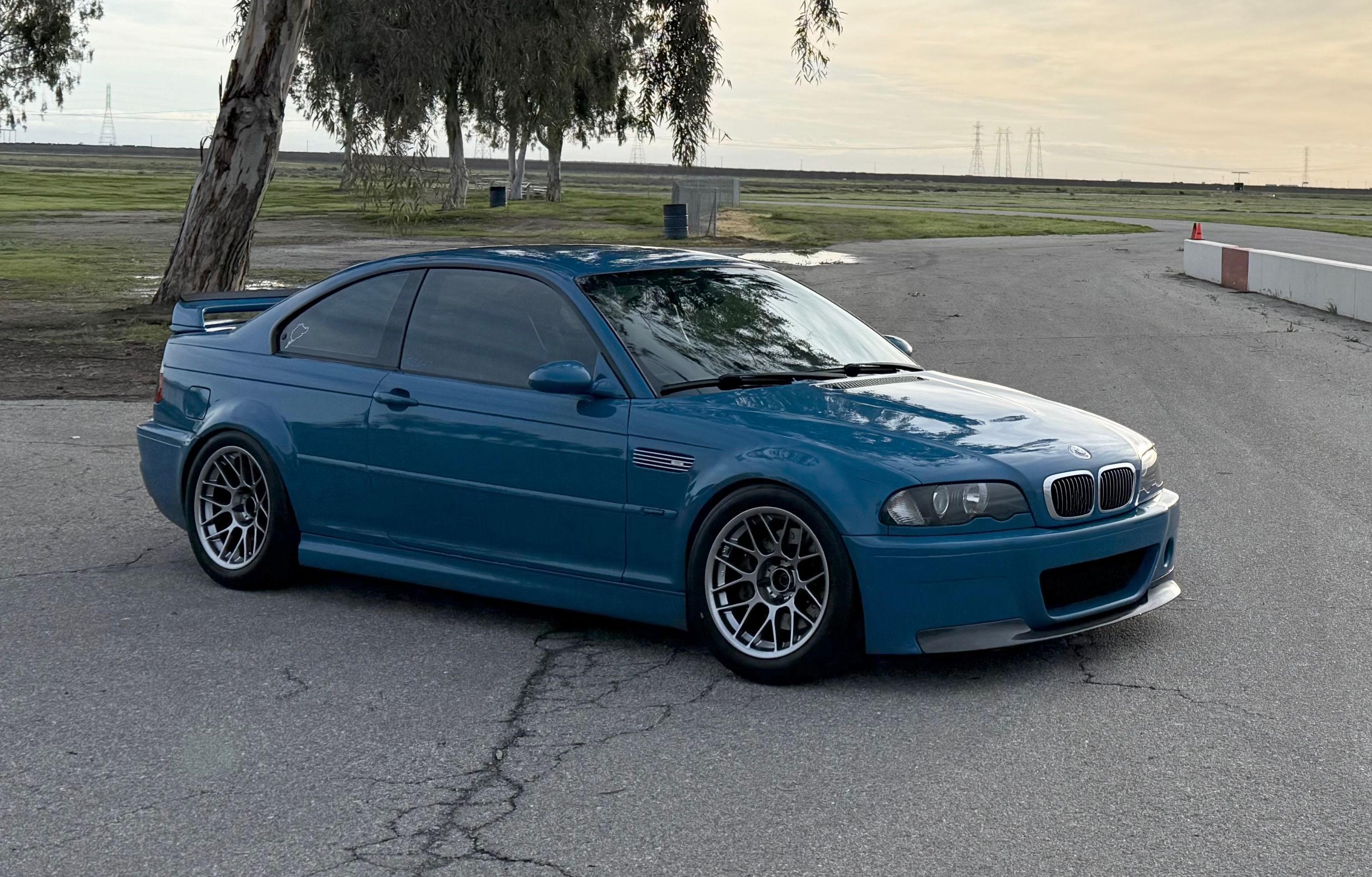 Blue BMW E46 M3 with 17" ARC-8 Apex wheels in Hyper Black