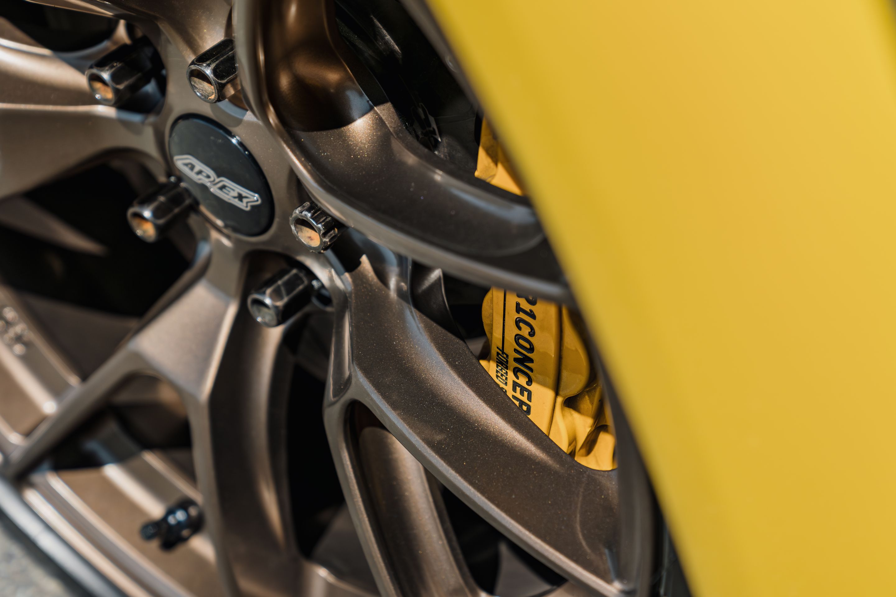 Yellow Mazda RX-8 with 18" VS-5RS Apex wheels in Satin Bronze