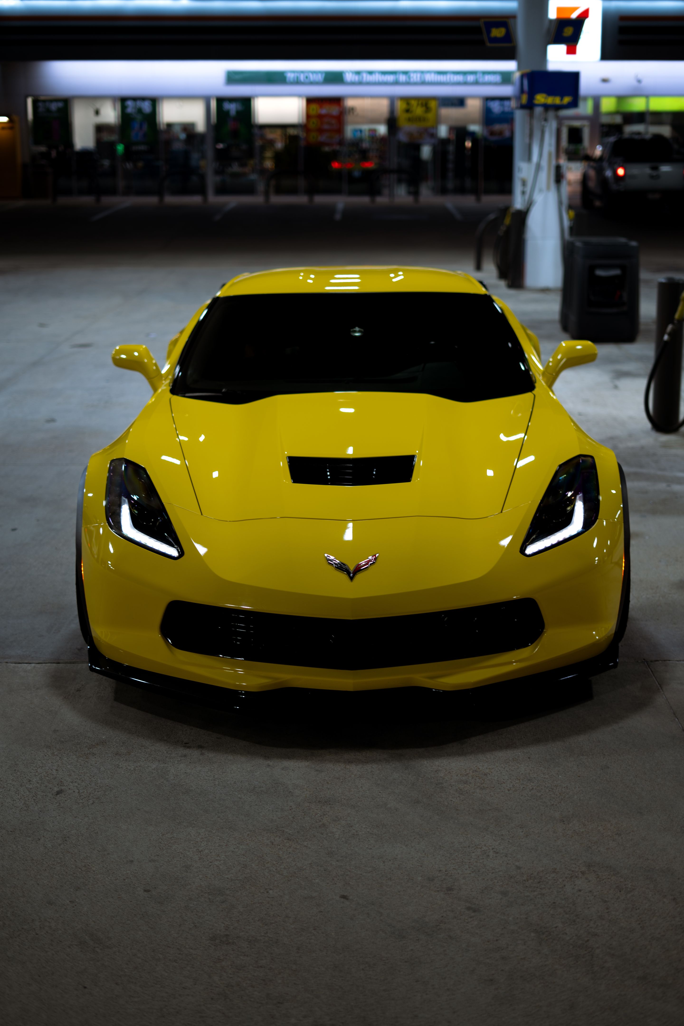 Yellow Chevrolet C7 Corvette Grand Sport with 19" SM-10 Apex wheels in Satin Black
