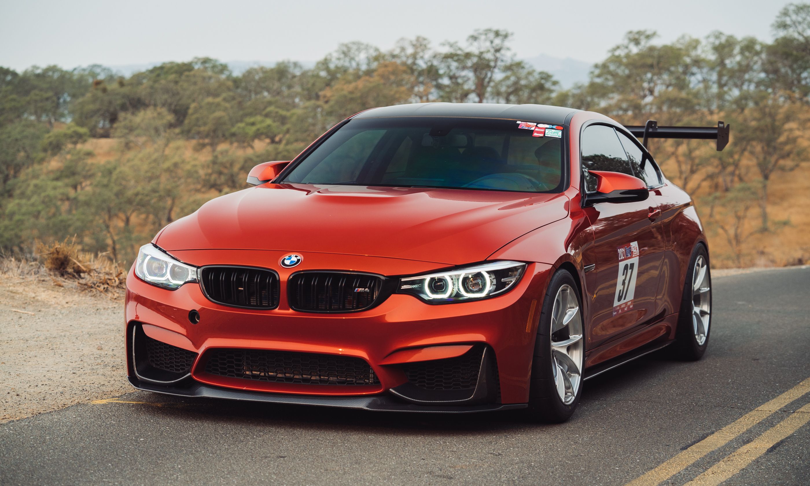 Orange BMW F82 Coupe M4 with 18" VS-5RS Apex wheels in Brushed Clear