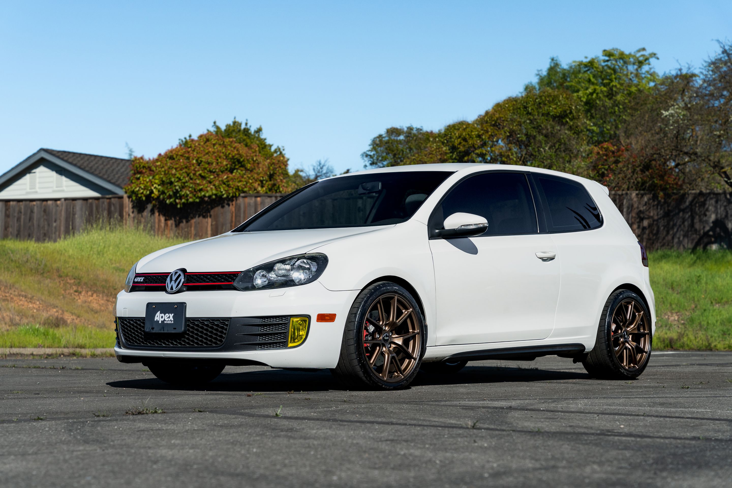 White VW MK6 GTI with 18" VS-5 Apex wheels in Satin Bronze