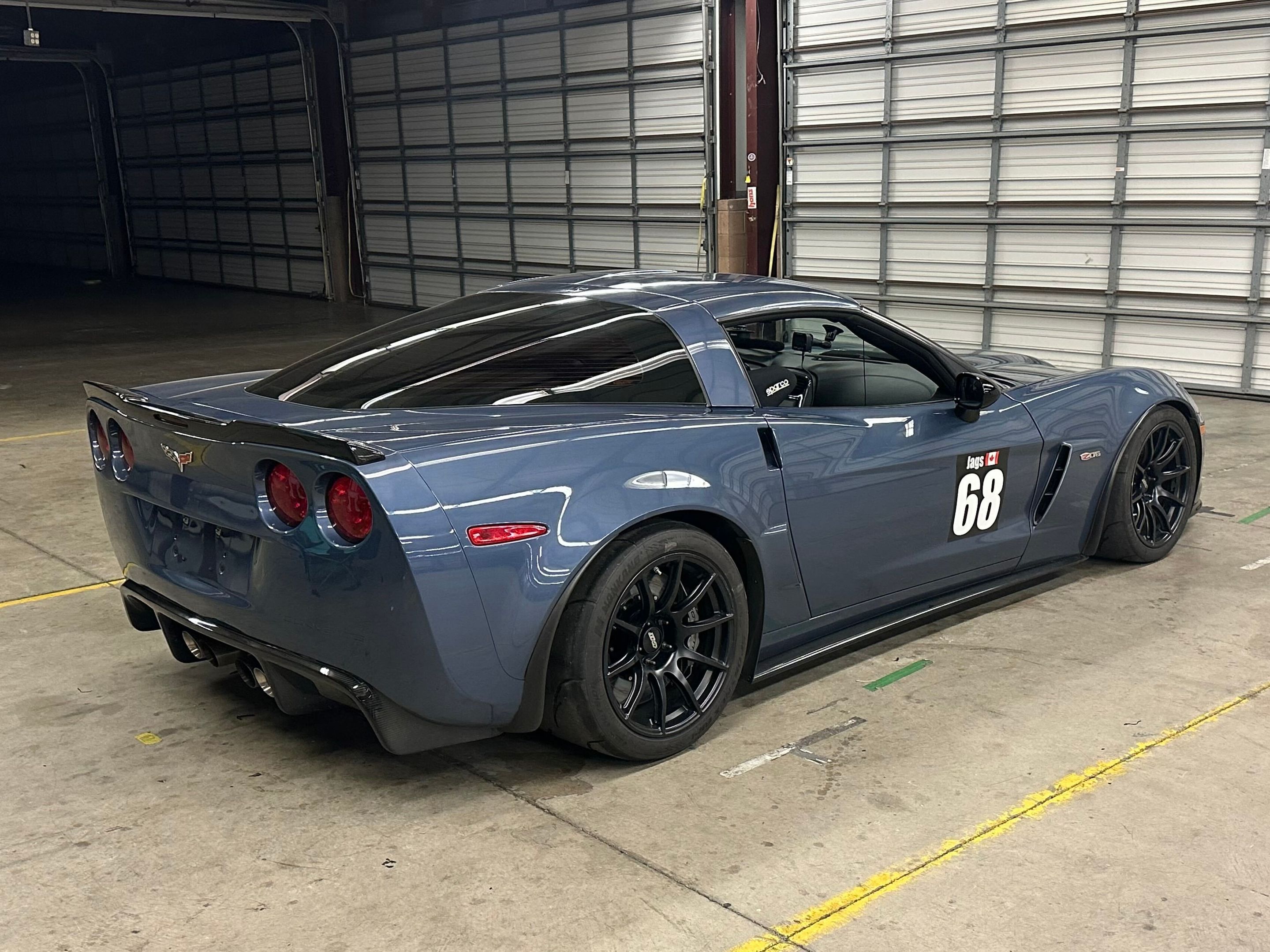 Blue Chevrolet C6 Corvette Z06 with 18" SM-10 Apex wheels in Satin Black
