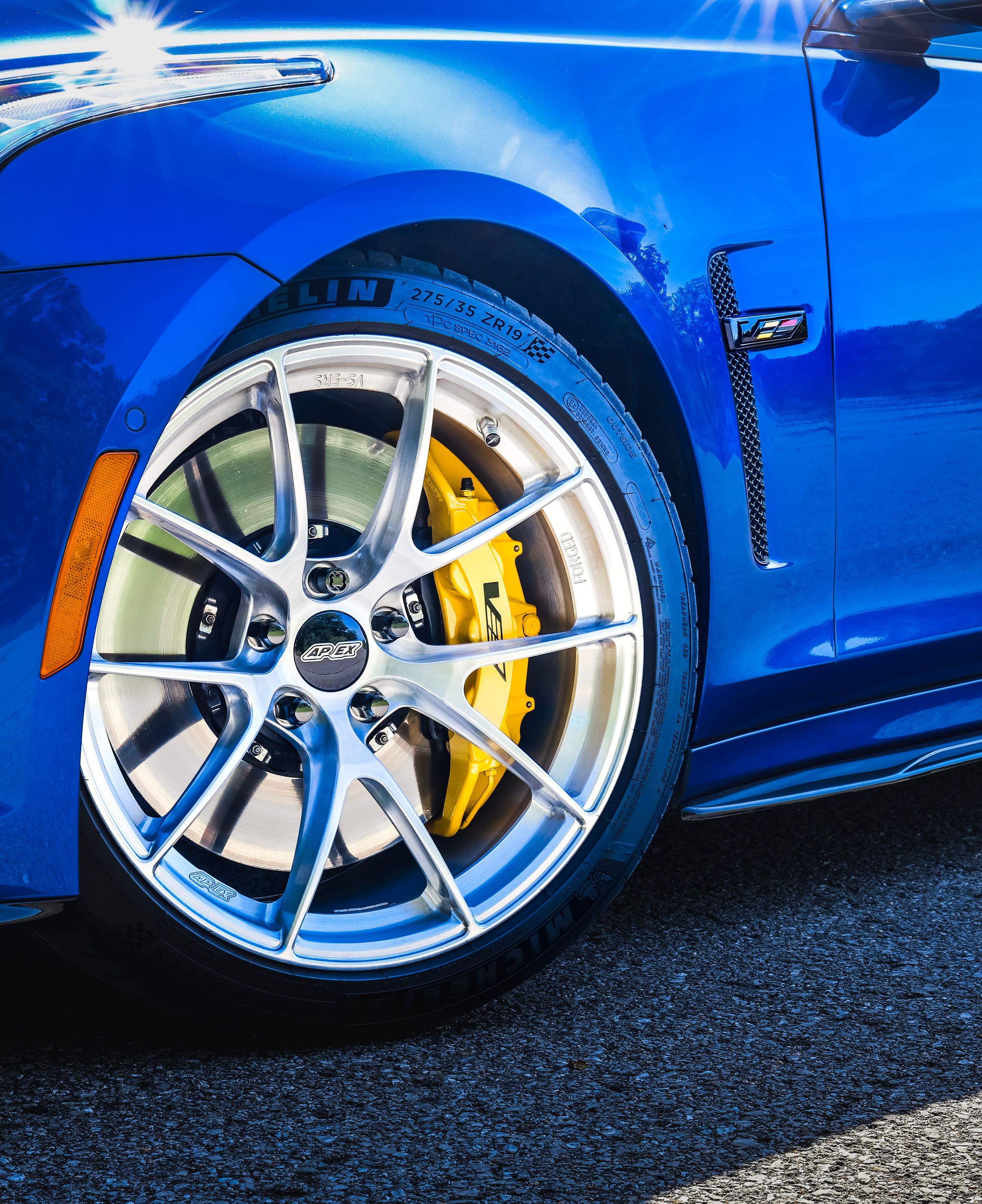 Blue Cadillac Gen 3 CTS-V with 19" VS-5RS Apex wheels in Brushed Clear