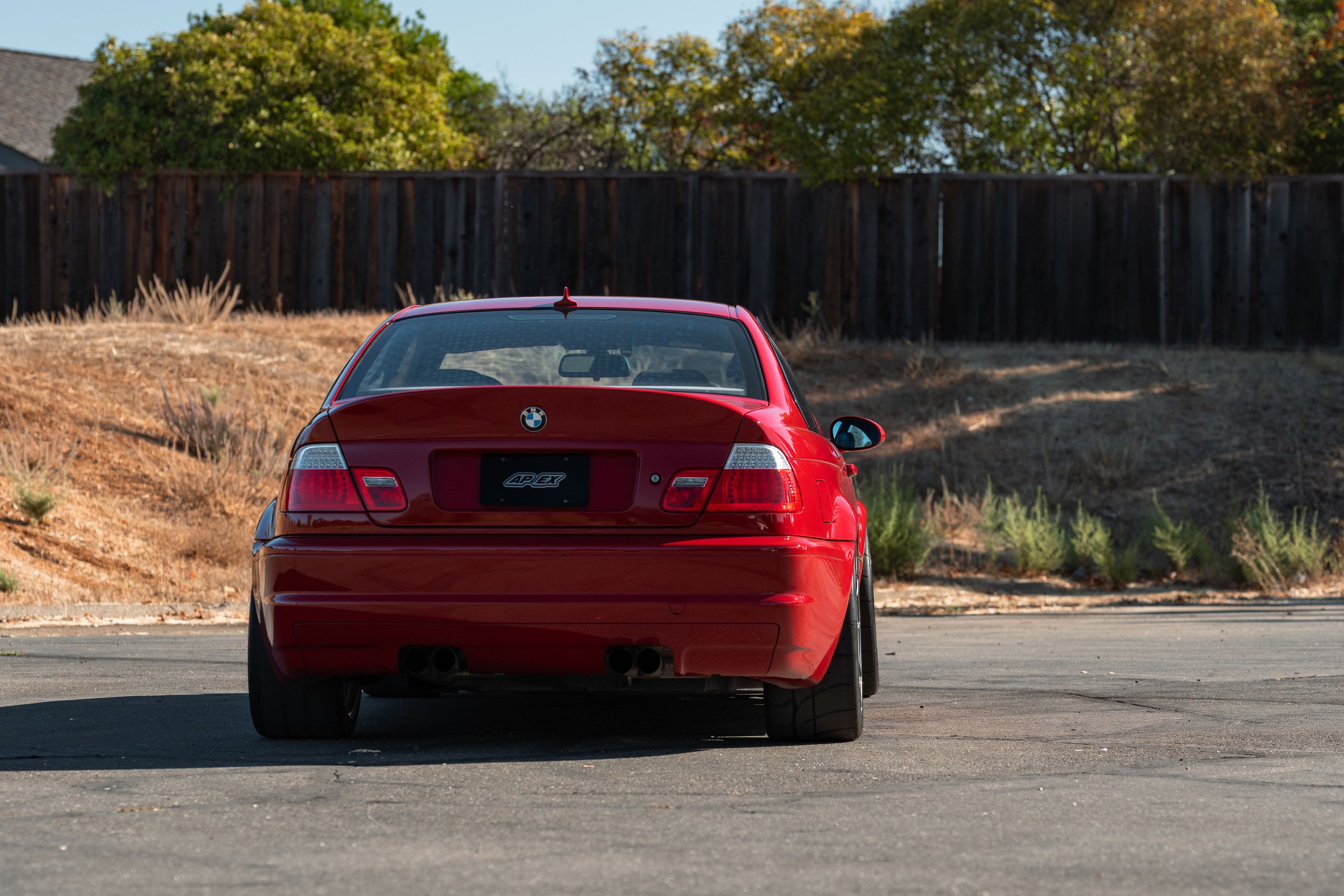 Red BMW E46 M3 with 18" SM-10RS Apex wheels in Anthracite