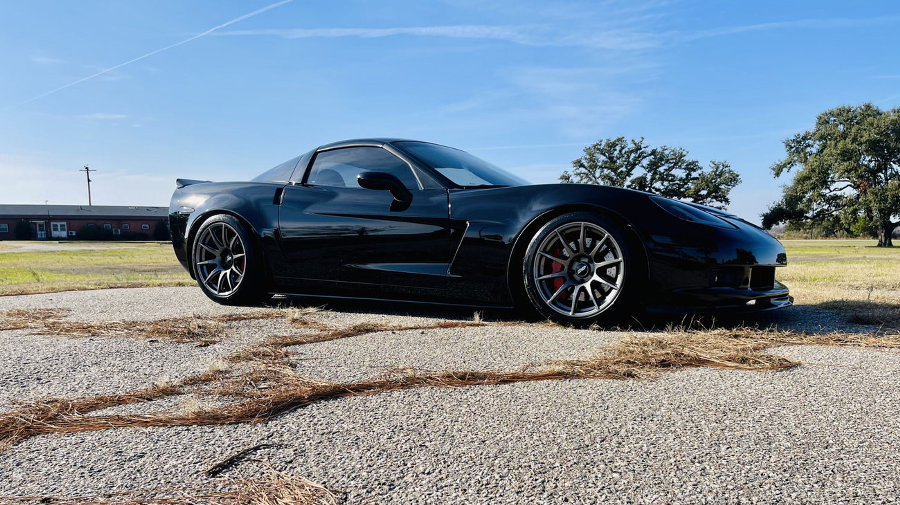 Black Chevrolet C6 Corvette Z06 with 18"/19" SM-10 Apex wheels in Anthracite