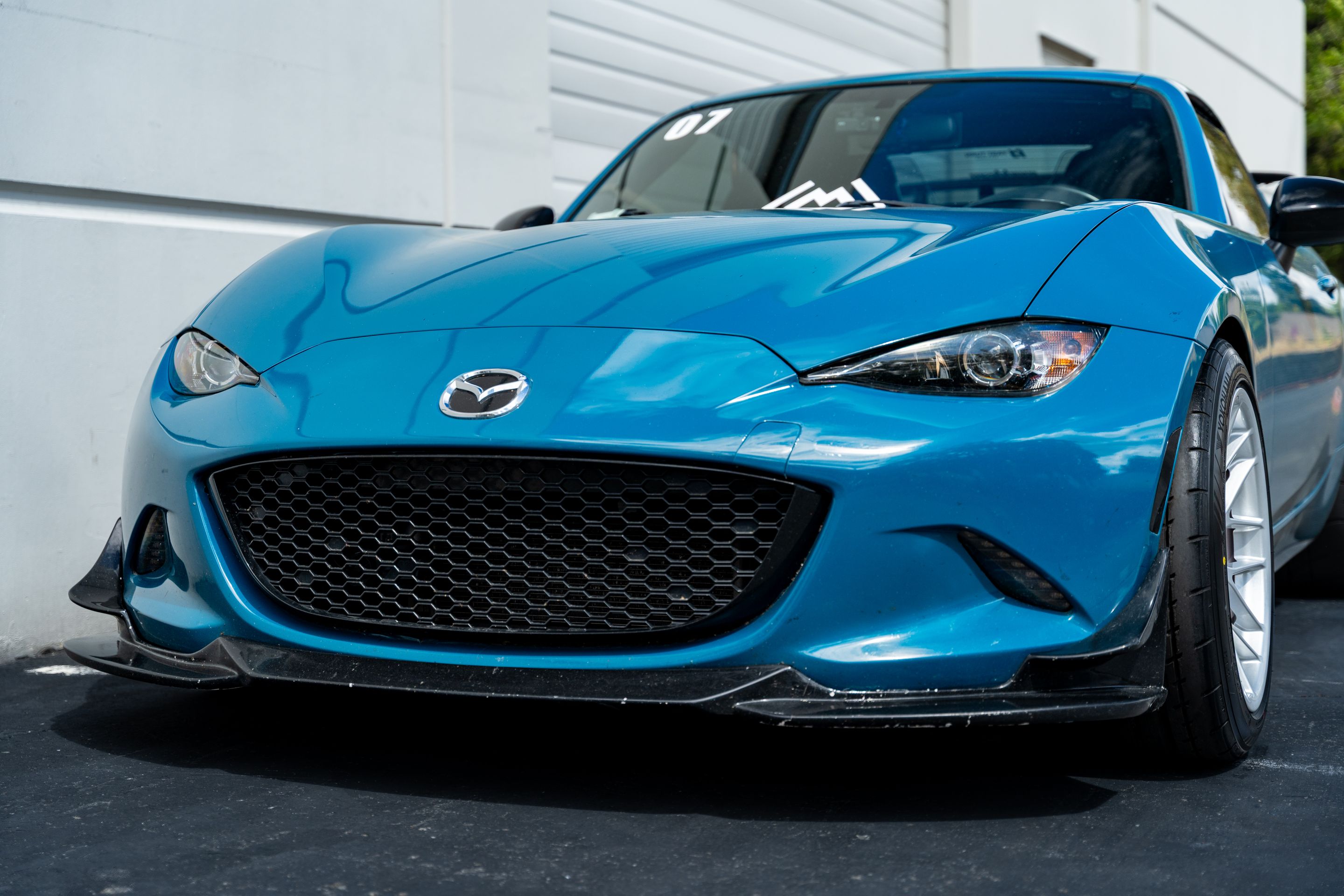 Blue Mazda ND MX-5 Miata with 17" ARC-8 Apex wheels in Race Silver