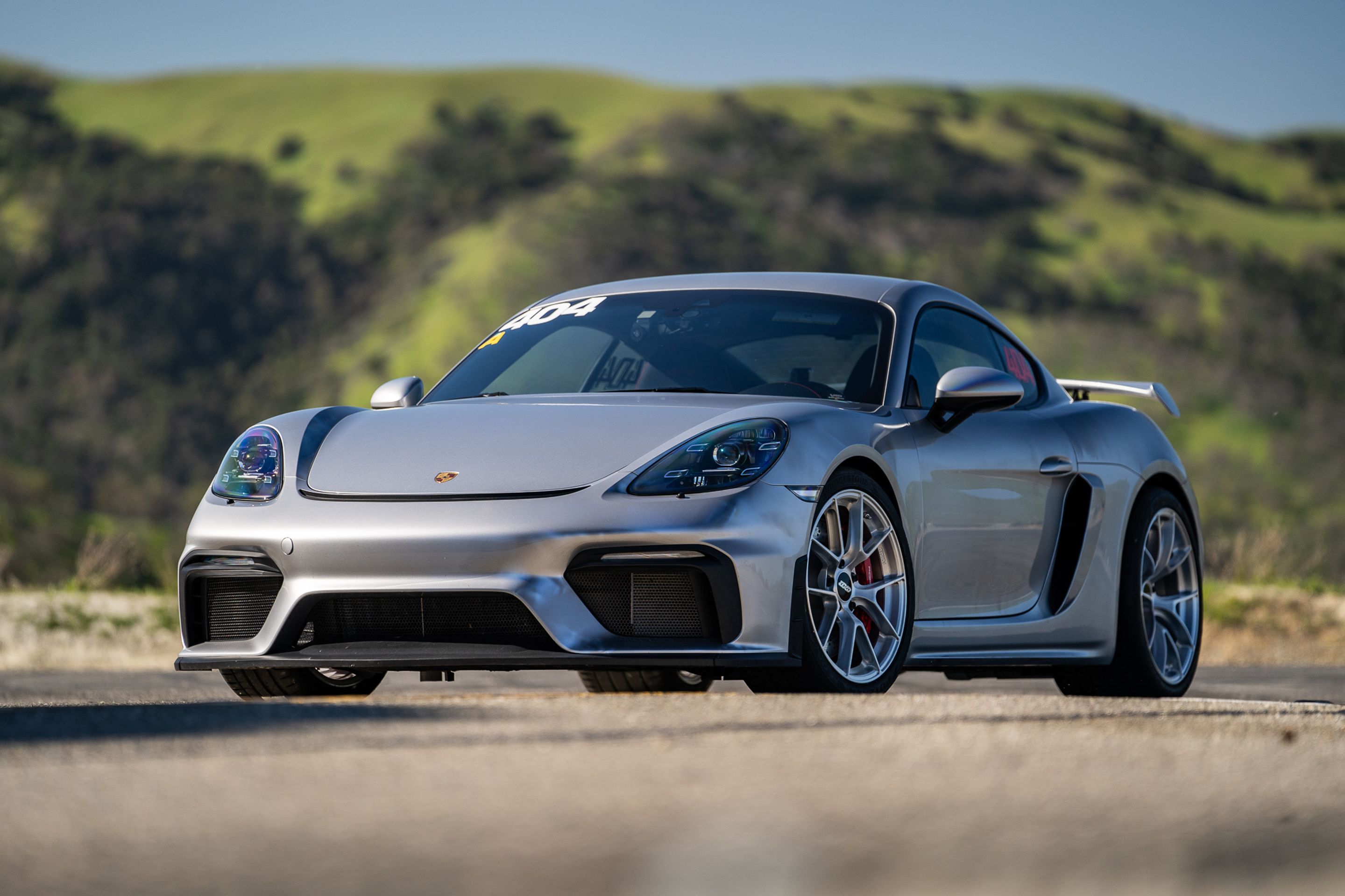 Grey Porsche 718 Cayman GT4 with 19" VS-5RS Apex wheels in Brushed Clear