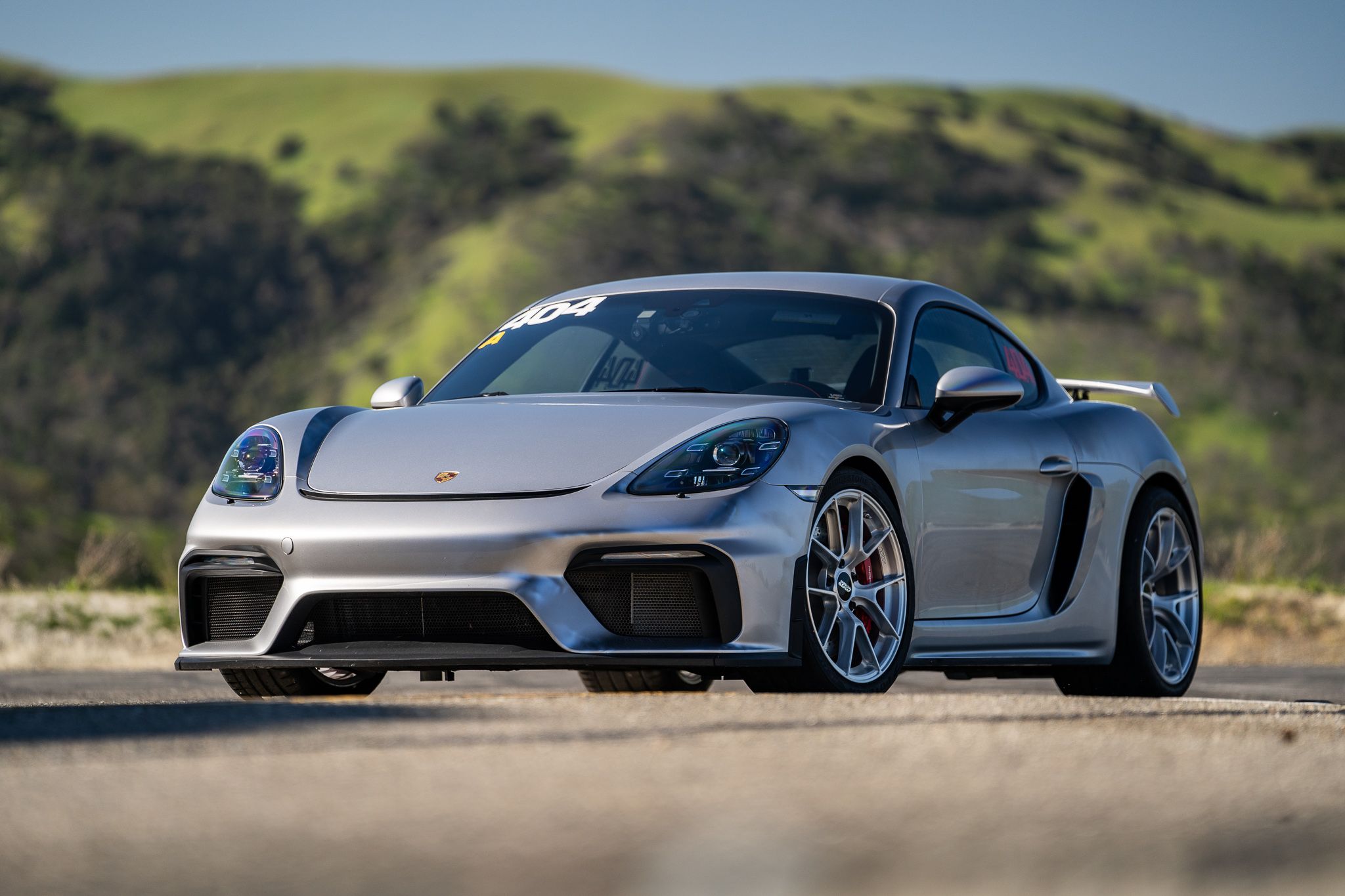 Grey Porsche 718 Cayman GT4 with 19" VS-5RS Apex wheels in Brushed Clear