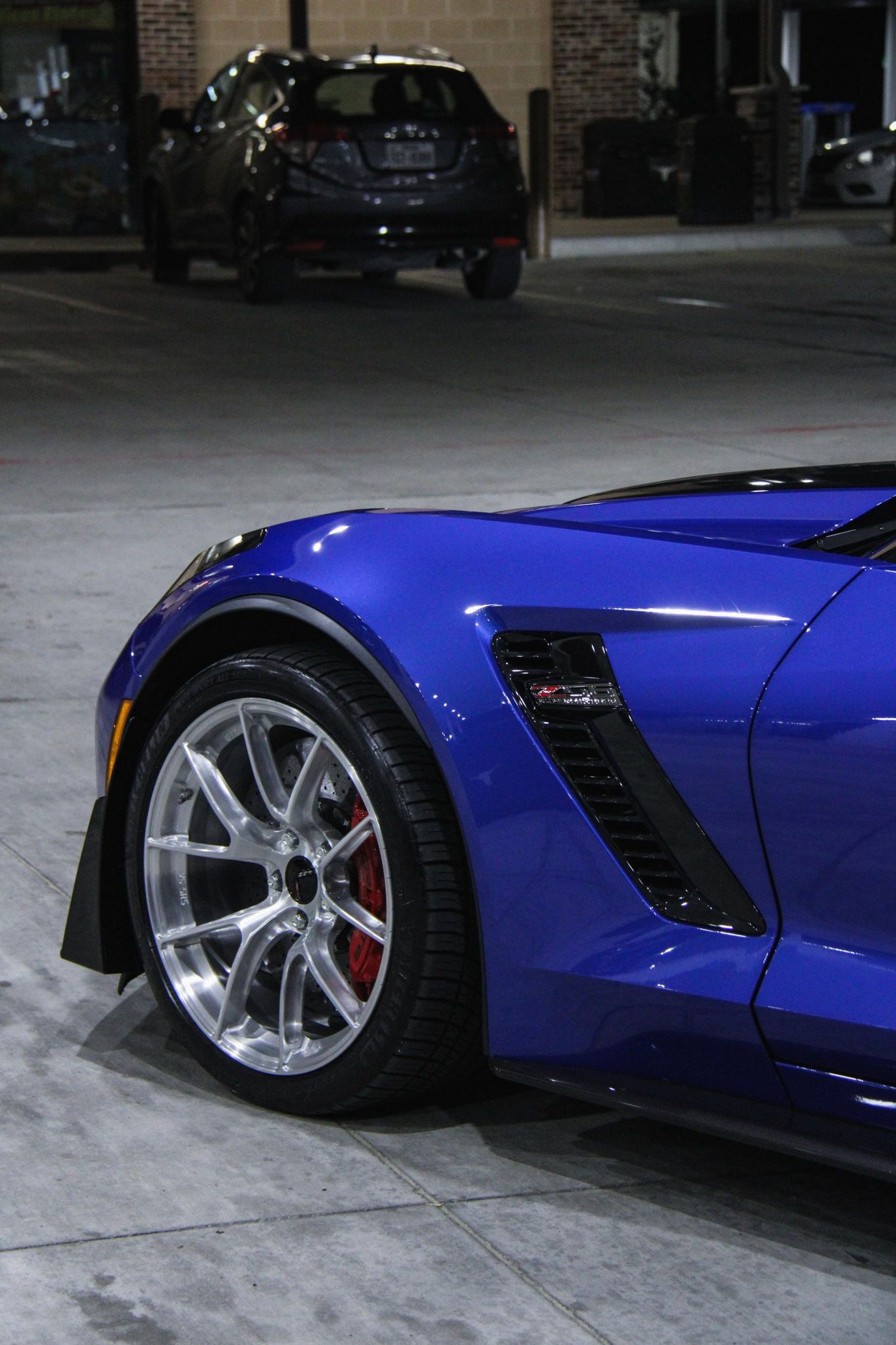 Blue Chevrolet C7 Corvette Z06 with 19"/20" VS-5RS Apex wheels in Brushed Clear