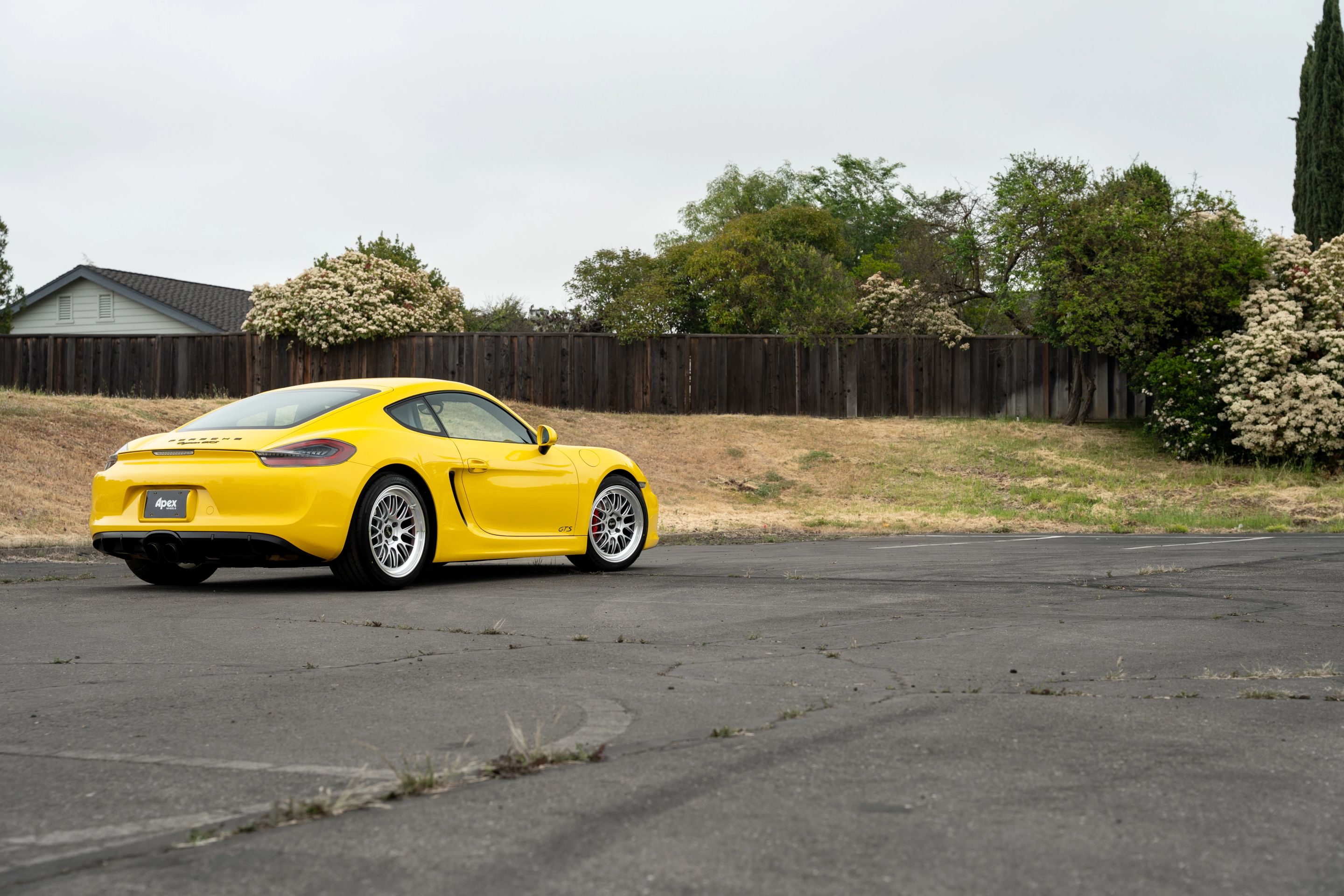 Yellow Porsche 981 Cayman GTS with 19" ML-10RT Apex wheels in Machined Lip Race Silver