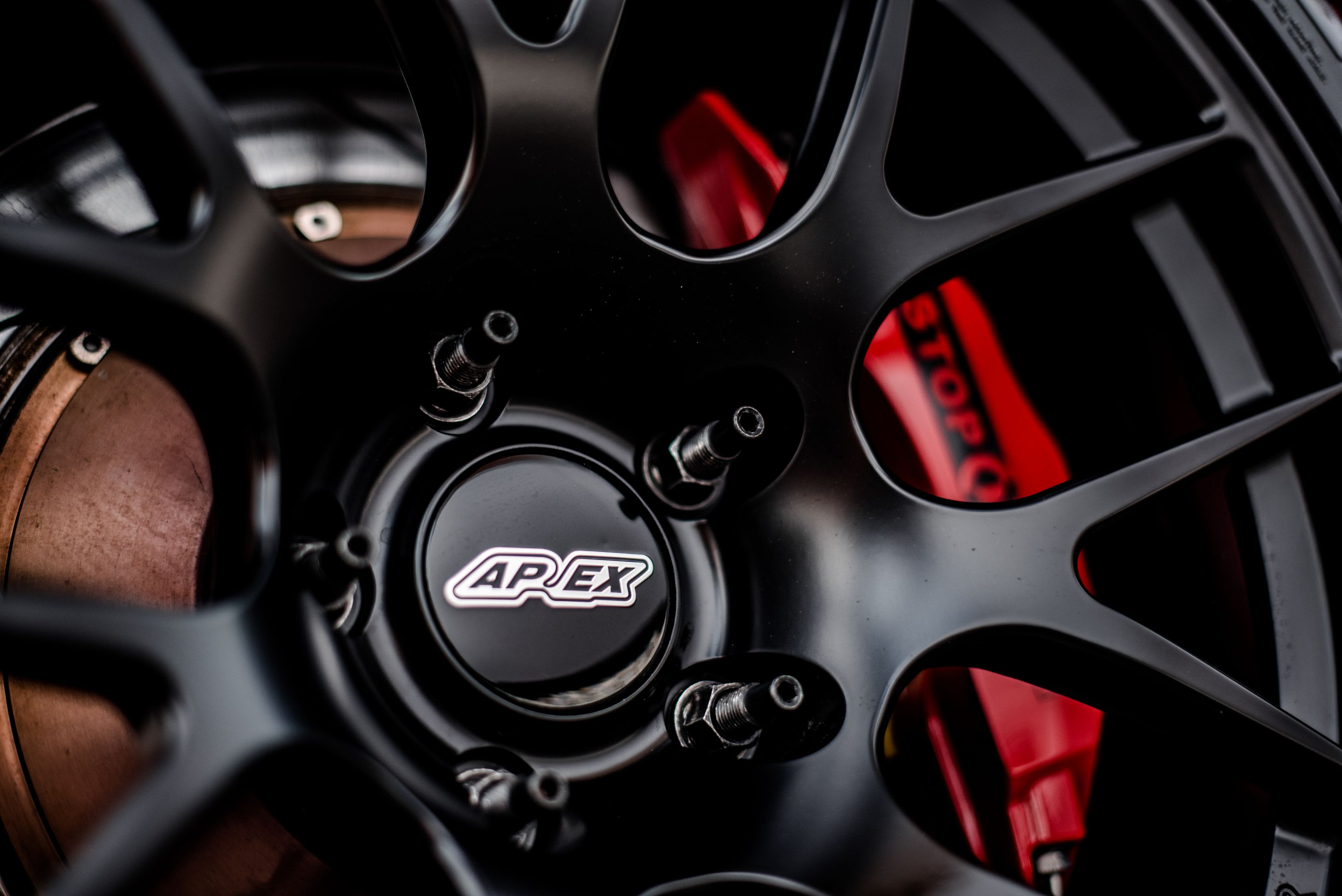 Red BMW E92 Coupe M3 with 18" EC-7R Apex wheels in Satin Black