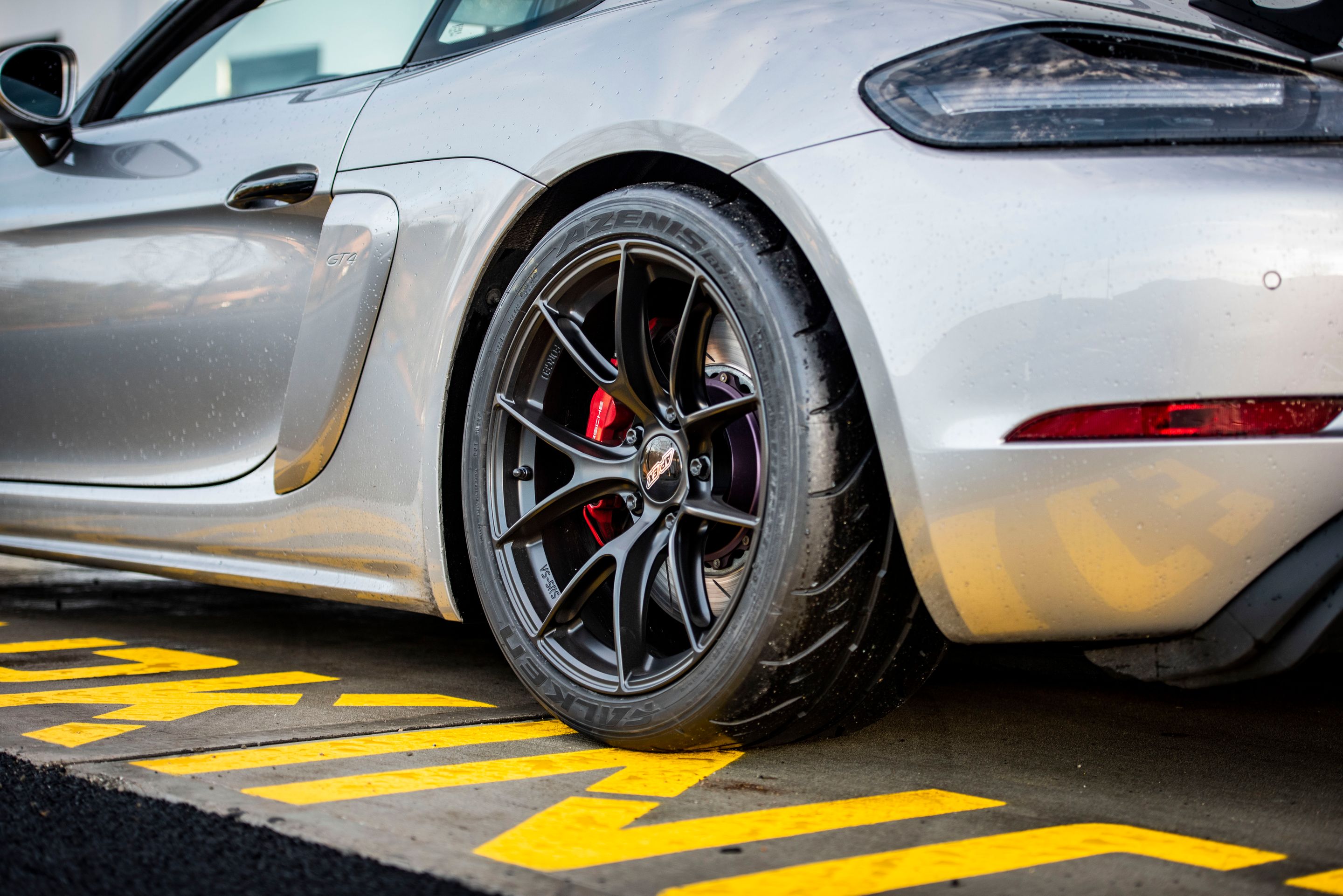 Silver Porsche 718 Cayman GT4 with 19" VS-5RS Apex wheels in Satin Black