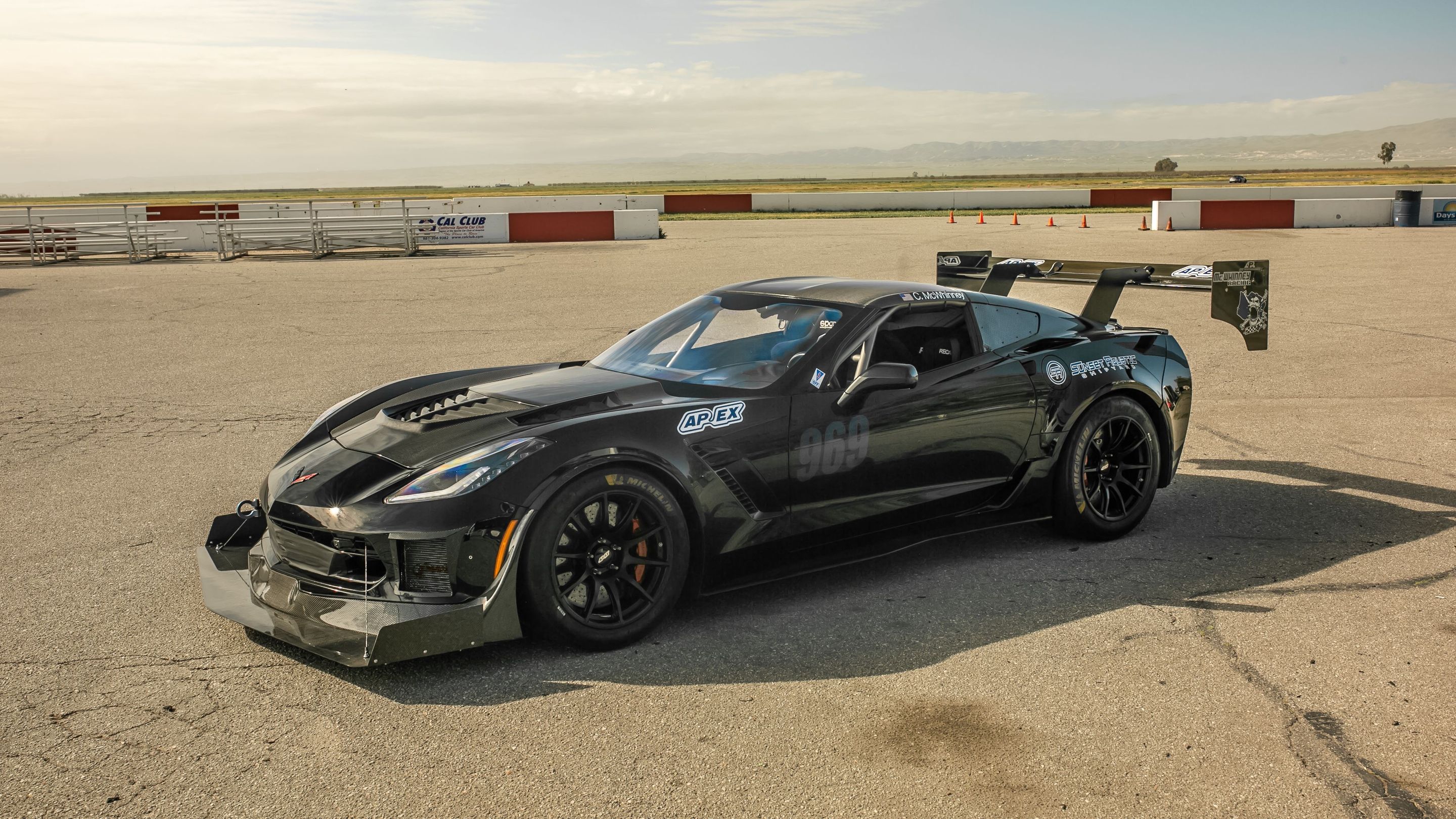 Black Chevrolet C7 Corvette Z06 with 18" SM-10 Apex wheels in Satin Black