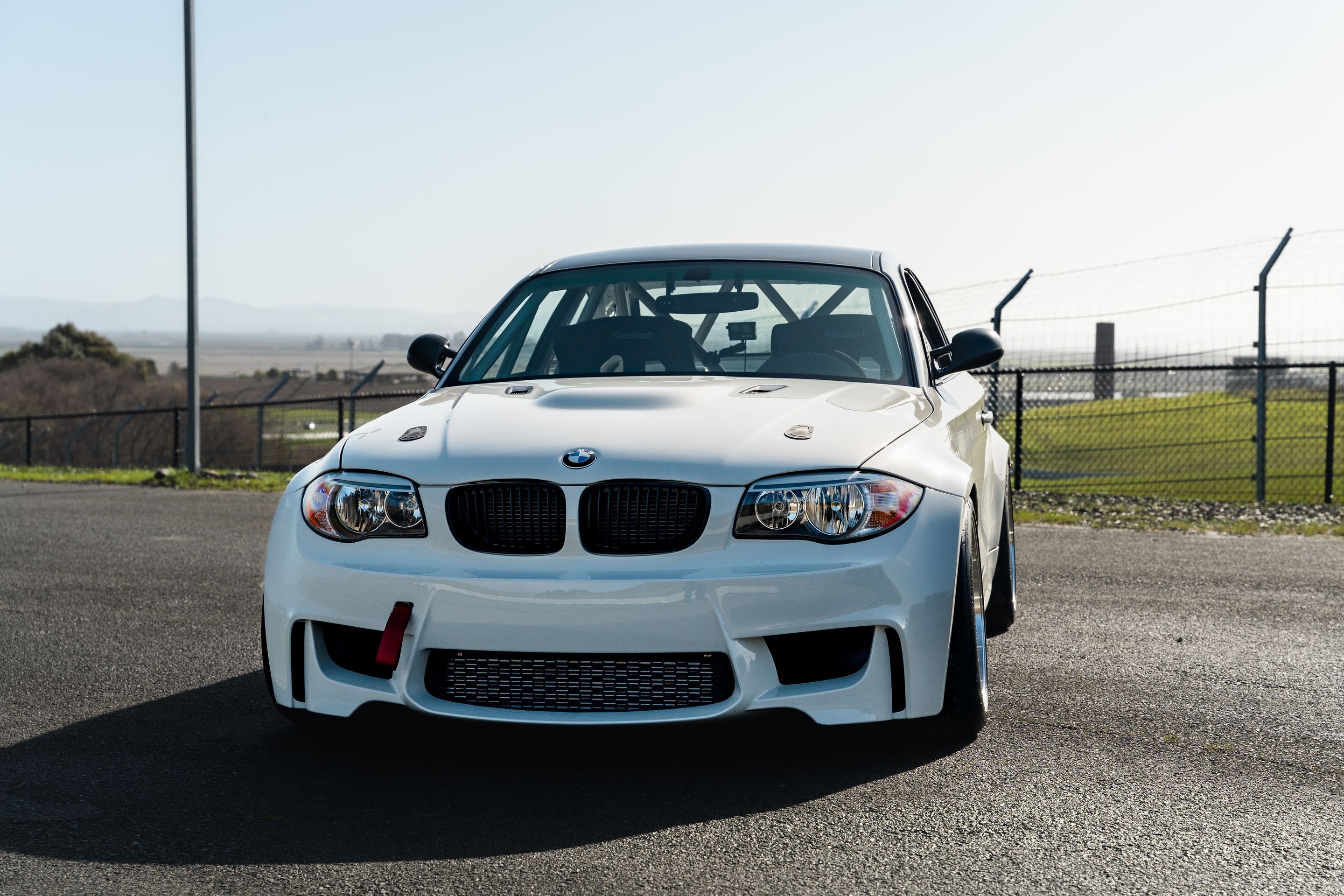 White BMW E82 1M with 18" ML-10RT Apex wheels in Machined Lip Gloss Motorsport Gold
