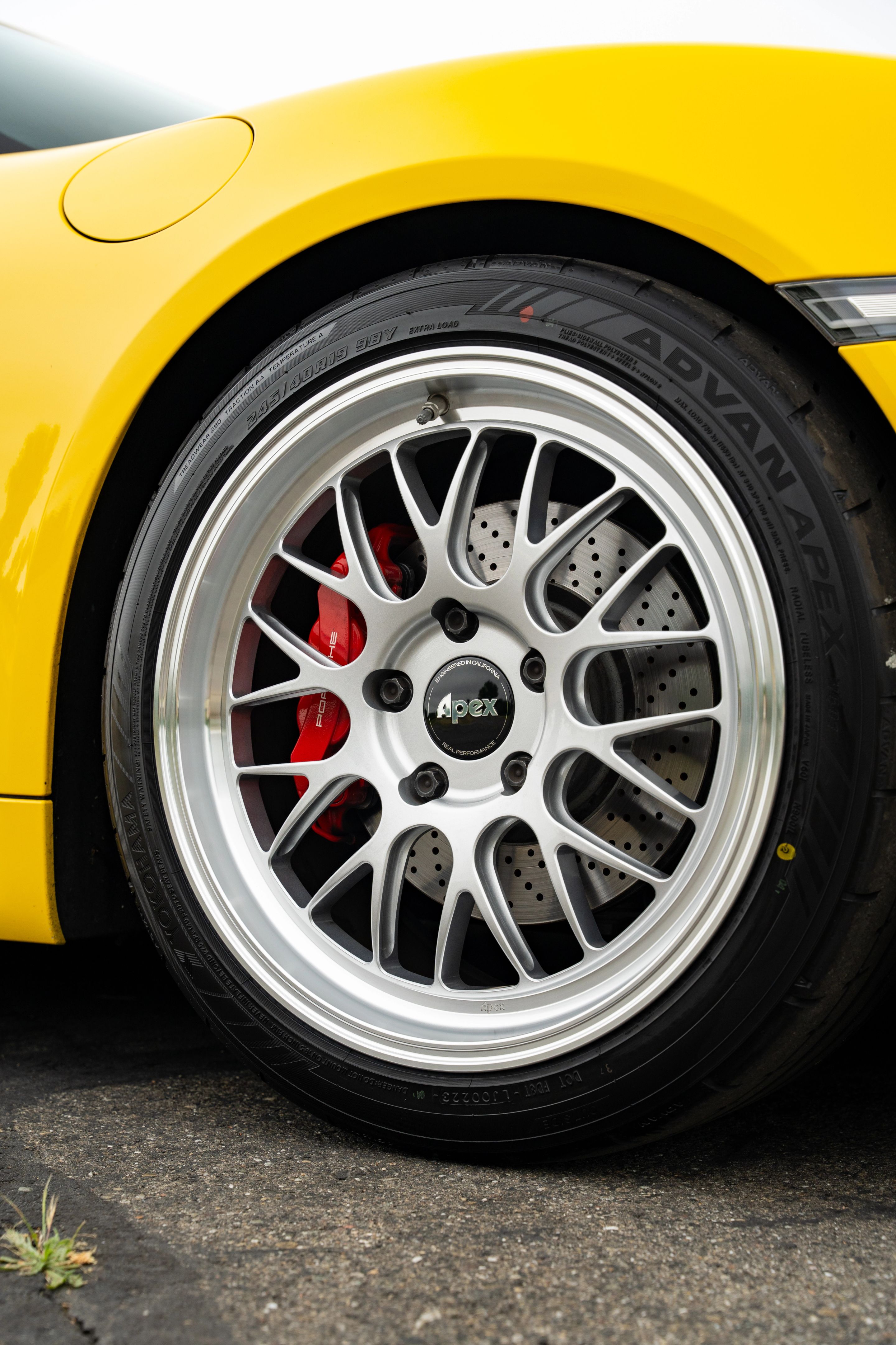 Yellow Porsche 981 Cayman GTS with 19" ML-10RT Apex wheels in Machined Lip Race Silver