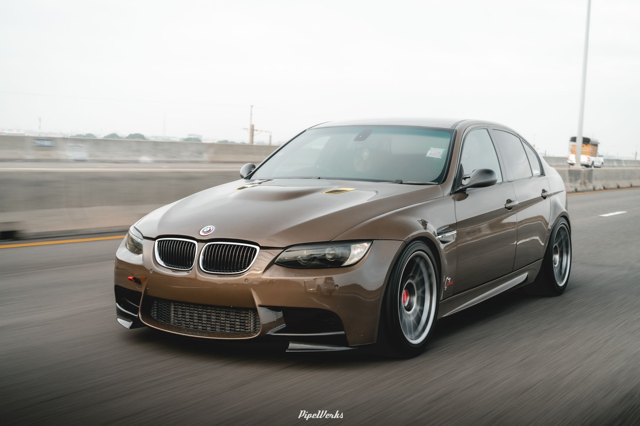 Brown BMW E90 Sedan 3 Series with 18" ARC-8 Apex wheels in Hyper Black