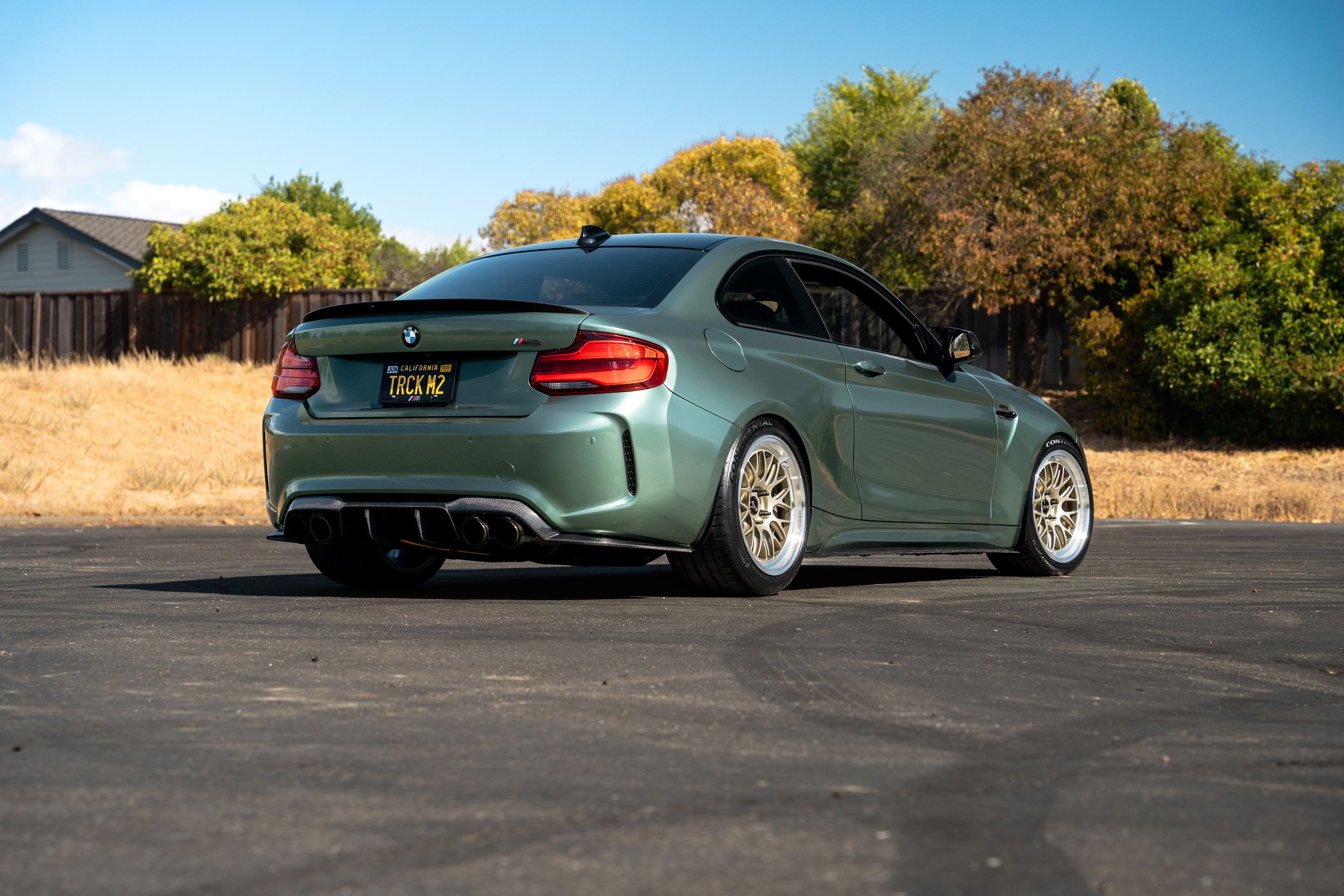 Green BMW F87 M2 with 18" ML-10RT Apex wheels in Machined Lip Gloss Motorsport Gold