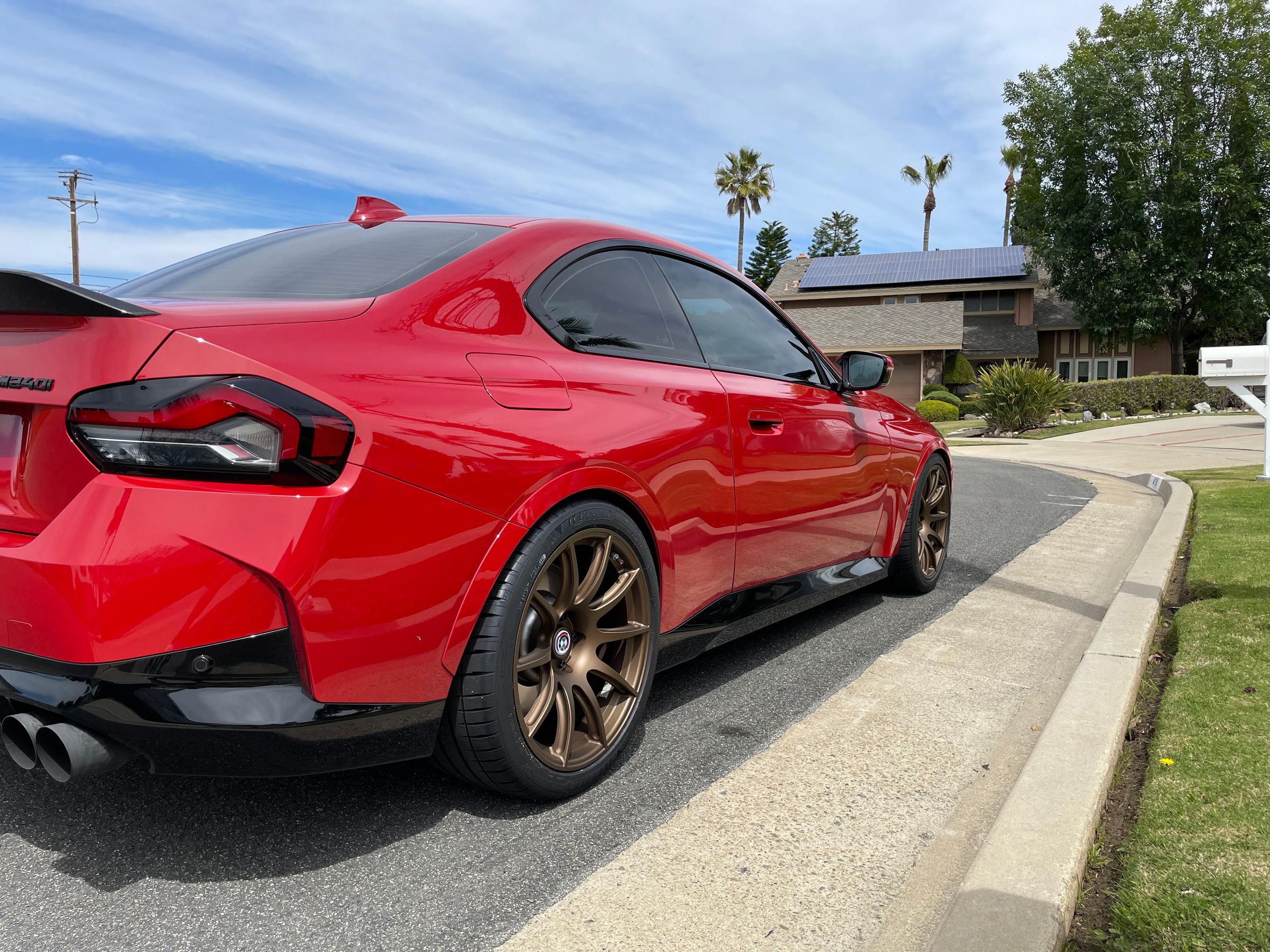 Red BMW G42 2 Series with 19" SM-10 Apex wheels in Satin Bronze