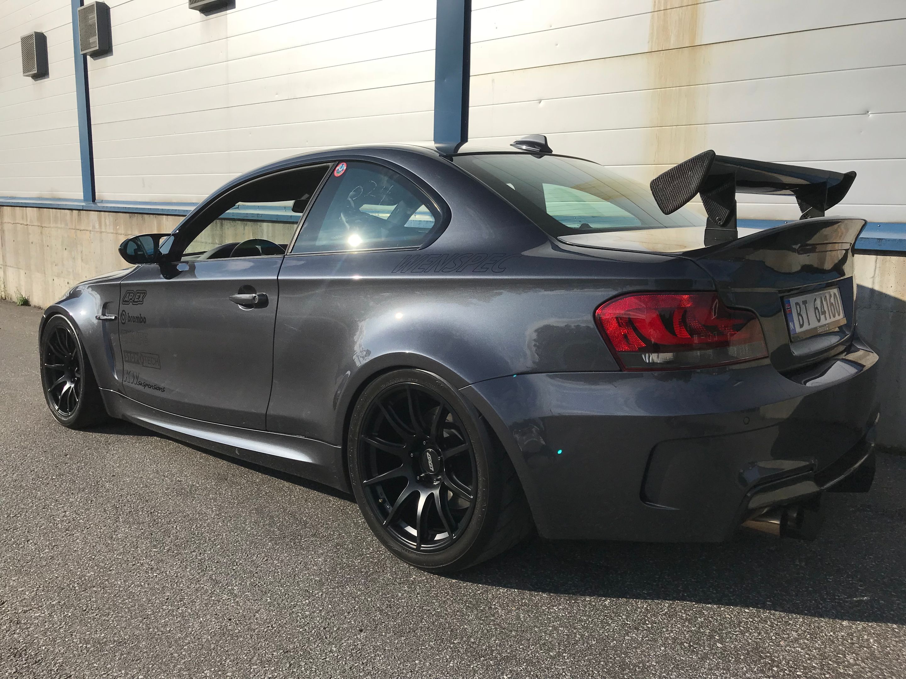 Grey BMW E82 1M with 18" SM-10 Apex wheels in Satin Black