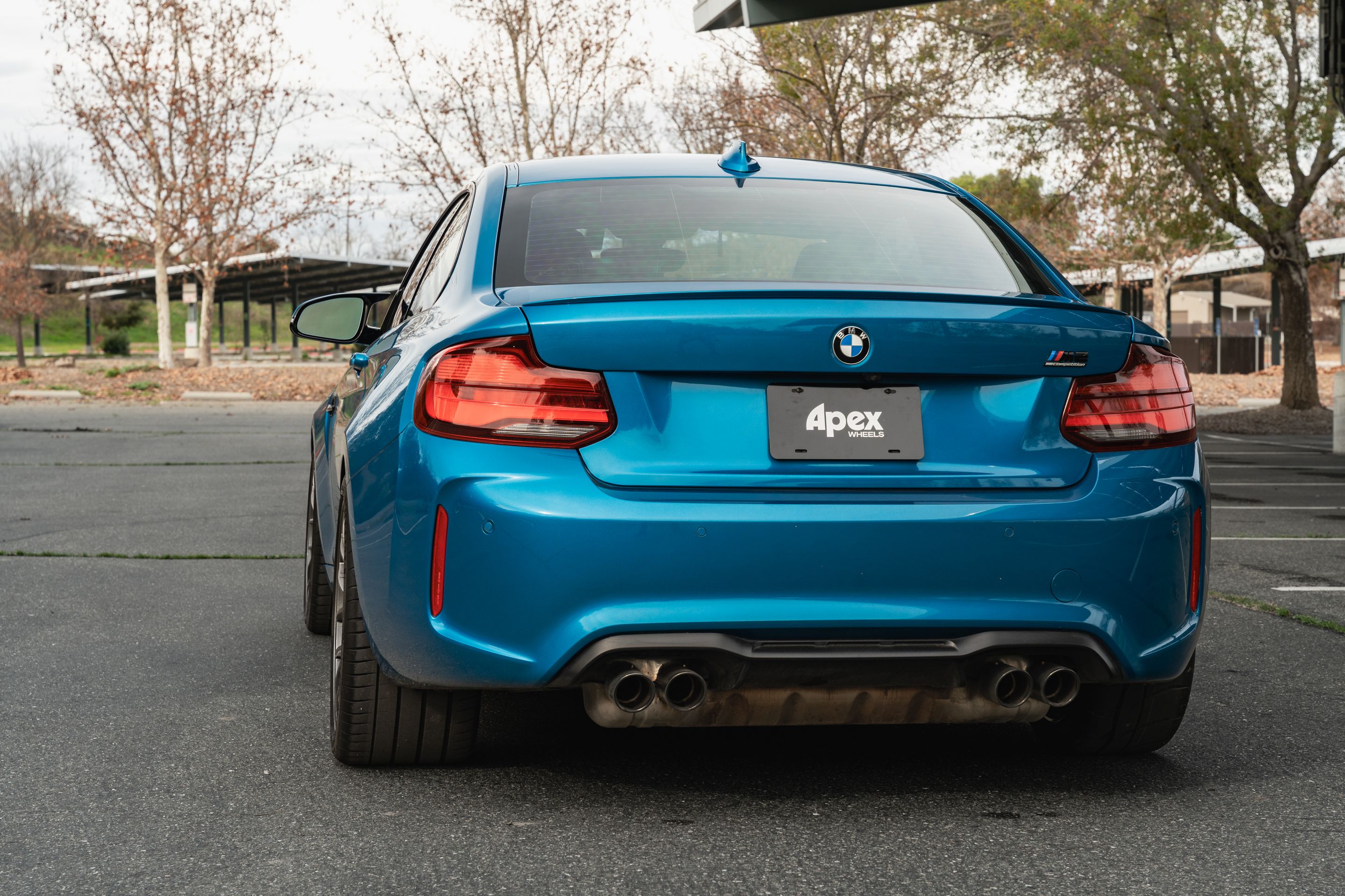 Blue BMW F87 M2 with 19" EC-7 Apex wheels in Anthracite