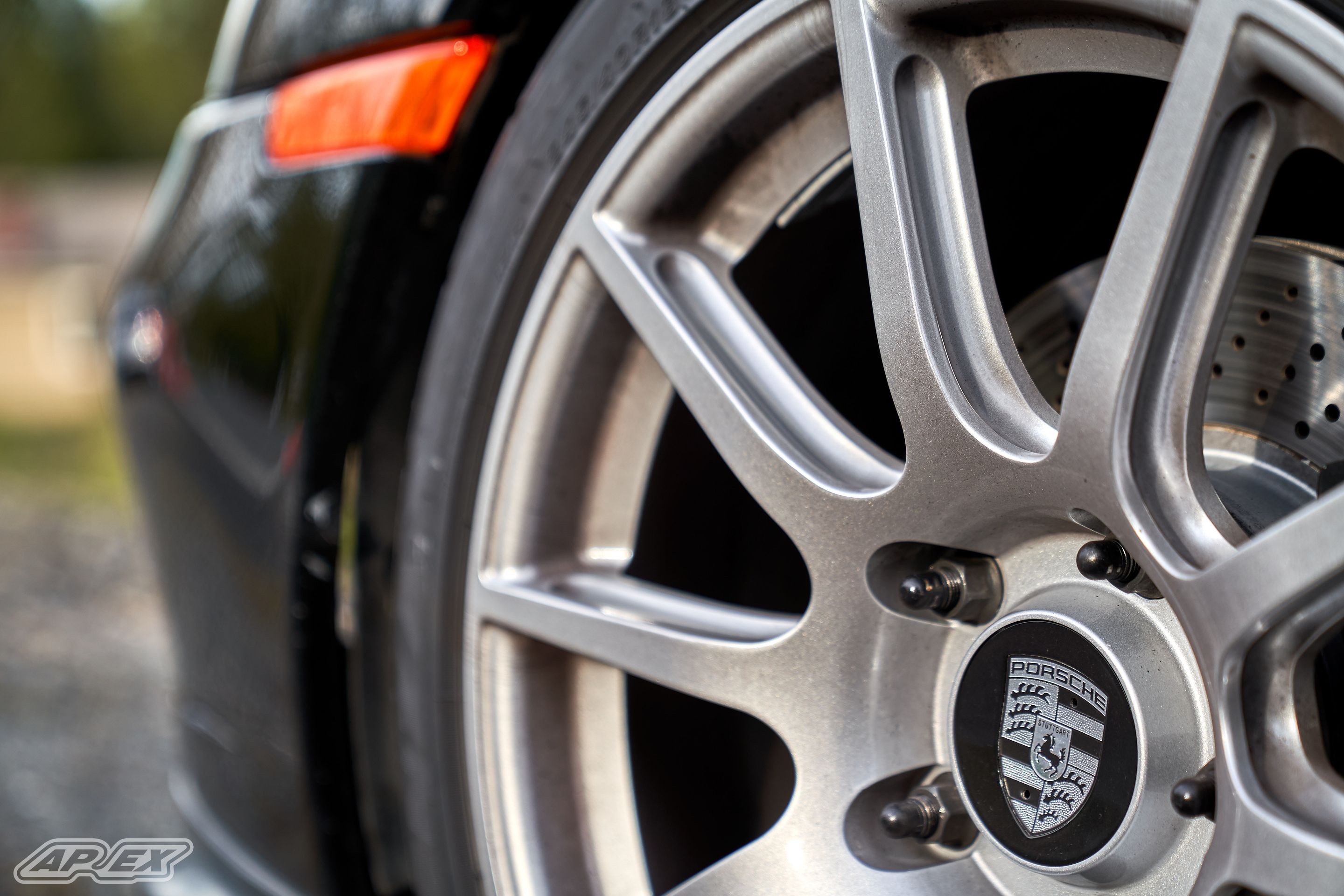 Black Porsche 911 996 Carrera with 18" SM-10 Apex wheels in Race Silver