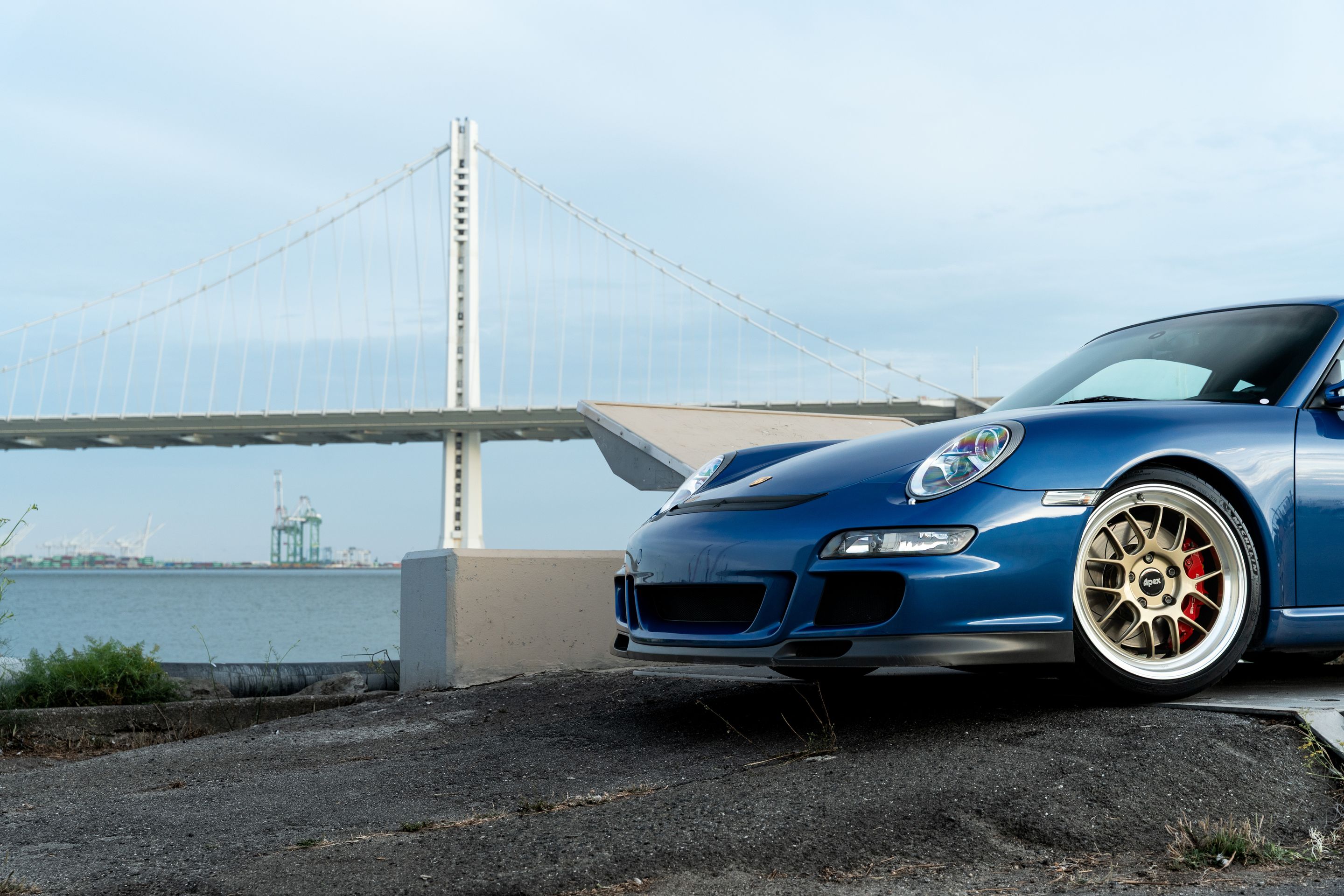 Blue Porsche 911 997 GT3 with 19" TEST-M Apex wheels in Machined Lip Gloss Motorsport Gold