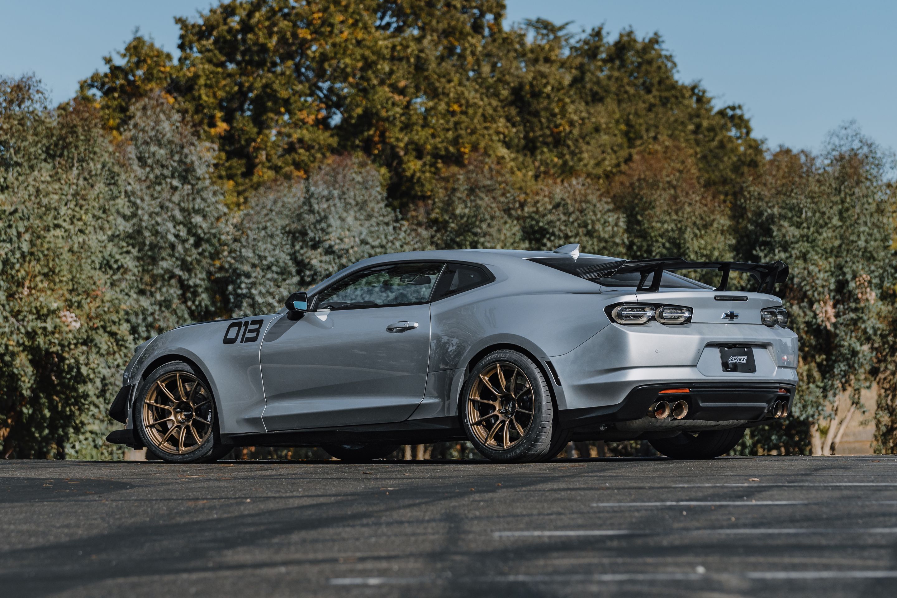 Silver Chevrolet 6th Gen Camaro ZL1 1LE with 19" SM-10RS Apex wheels in Satin Bronze