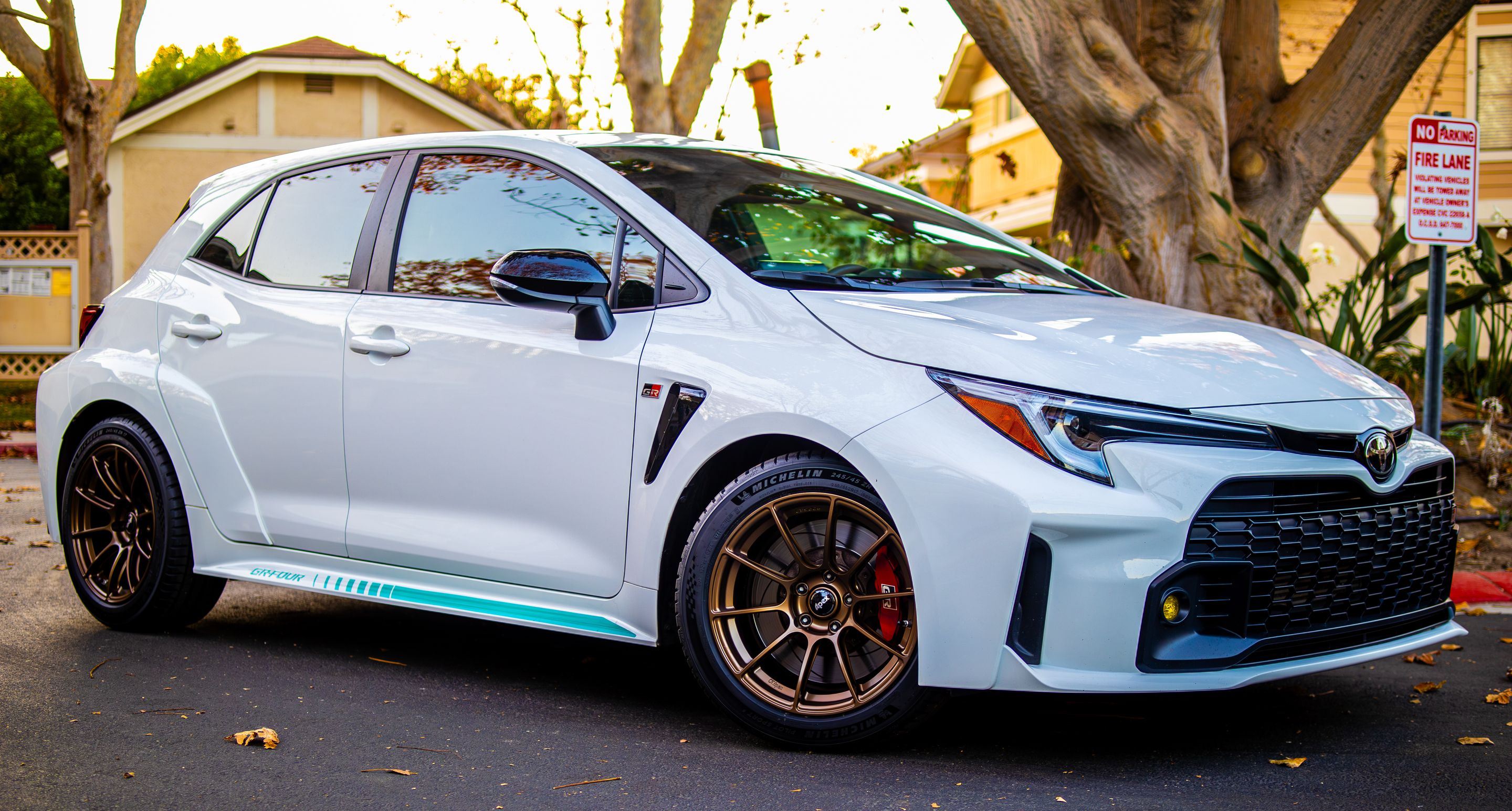 White Toyota GR Corolla with 17" SM-10RS Apex wheels in Satin Bronze