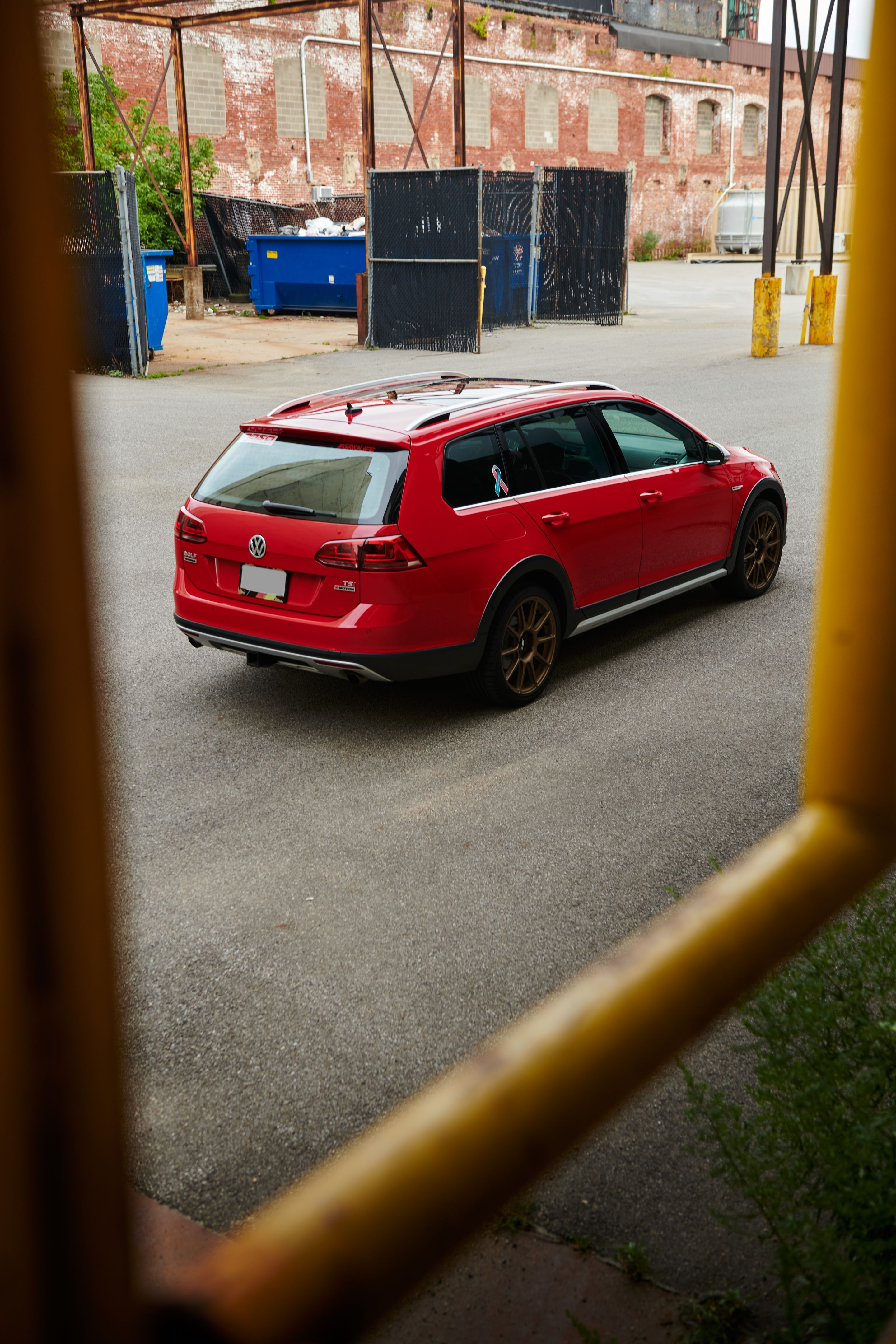 Red VW MK7 Alltrack/SportWagen Alltrack with 18" SM-10 Apex wheels in Satin Bronze