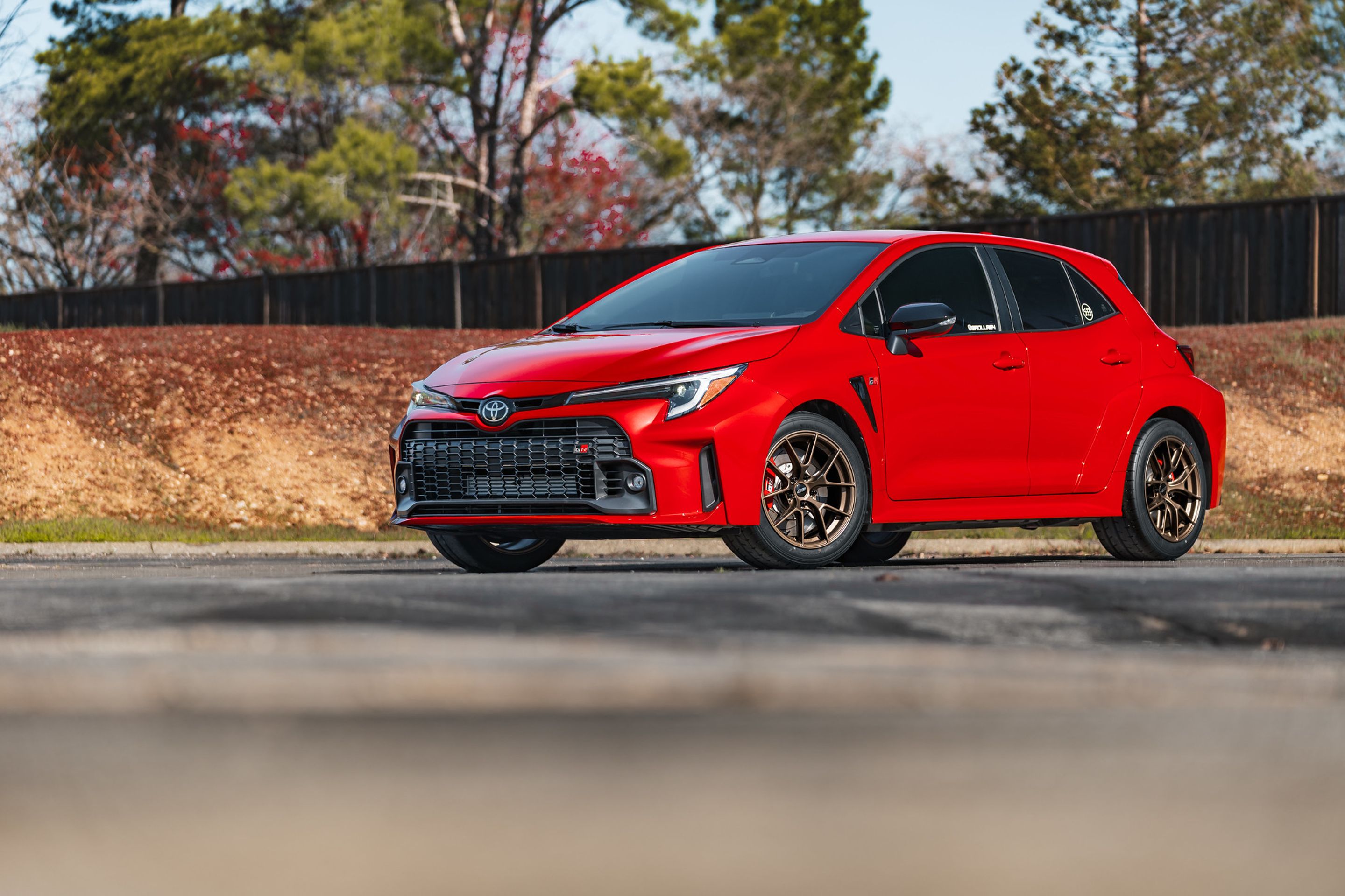 Red Toyota GR Corolla with 17" VS-5RS Apex wheels in Satin Bronze