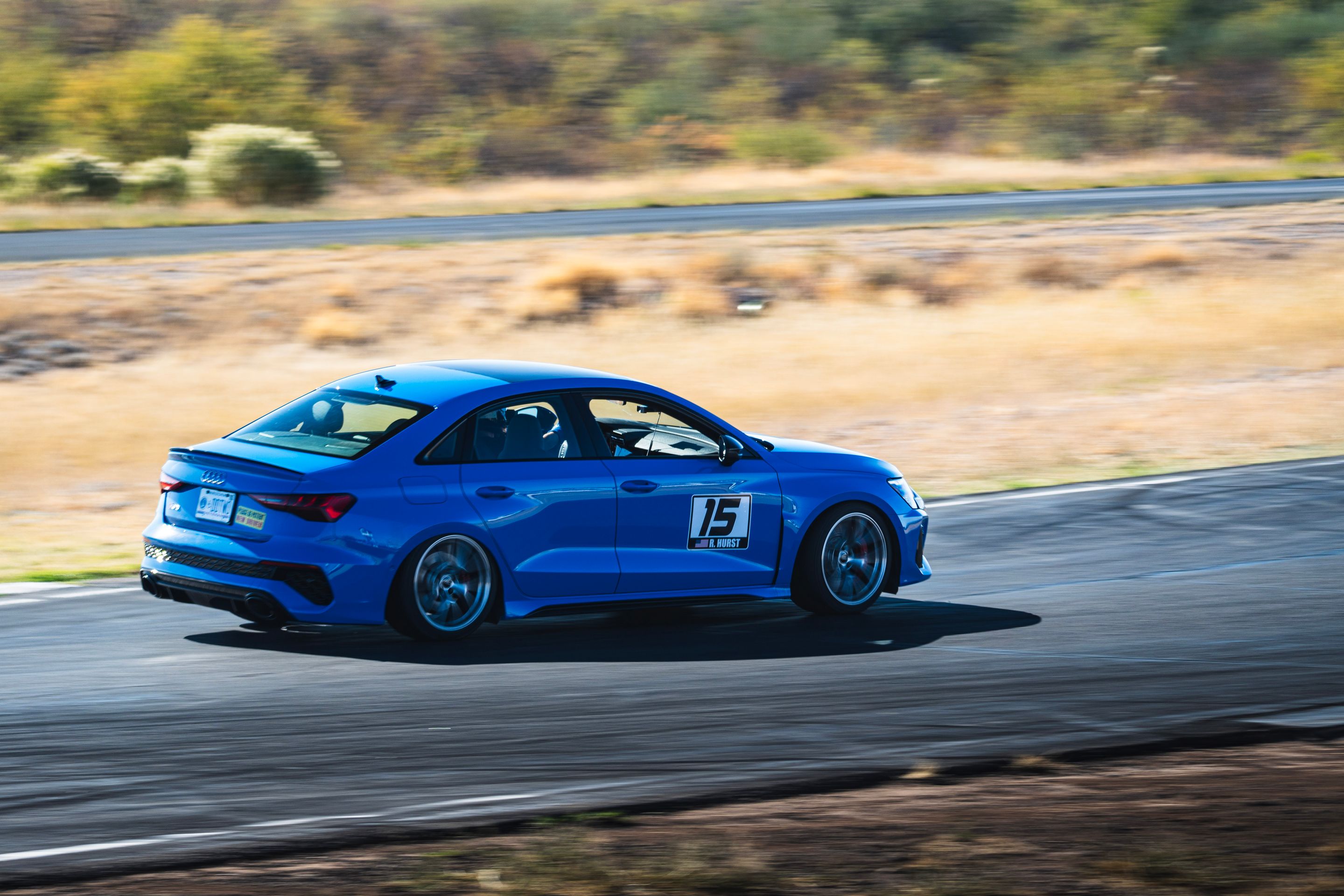 Blue Audi 8Y RS 3 with 18" VS-5RS Apex wheels in Brushed Clear