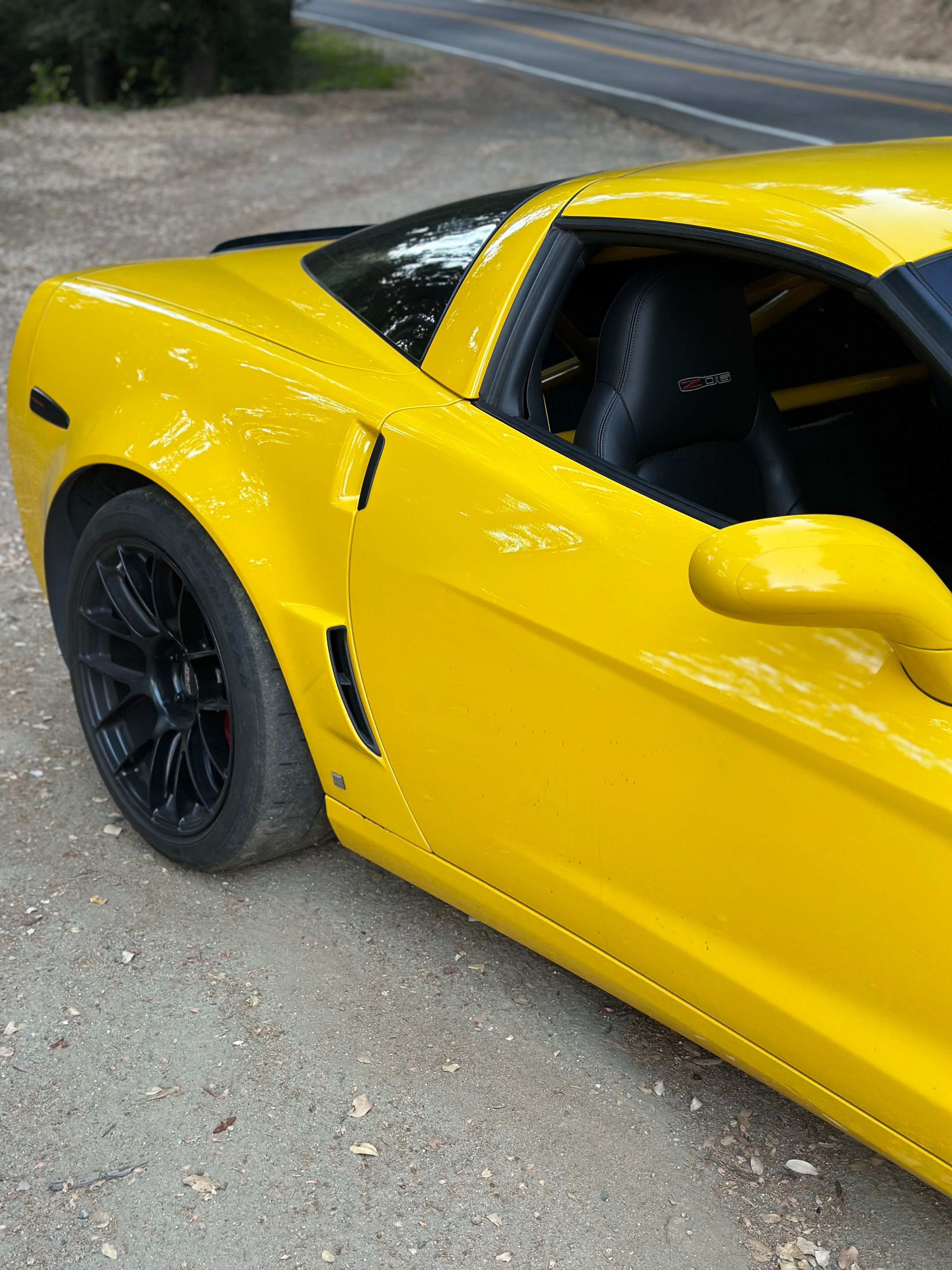 Yellow Chevrolet C6 Corvette Z06 with 19" EC-7RS Apex wheels in Satin Black