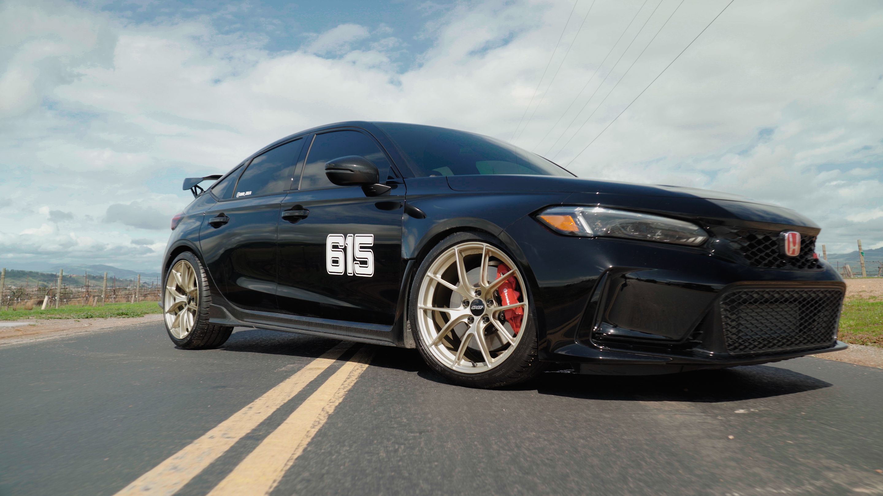 Black Honda FL5 Civic Type-R with 19" VS-5RS Apex wheels in Motorsport Gold