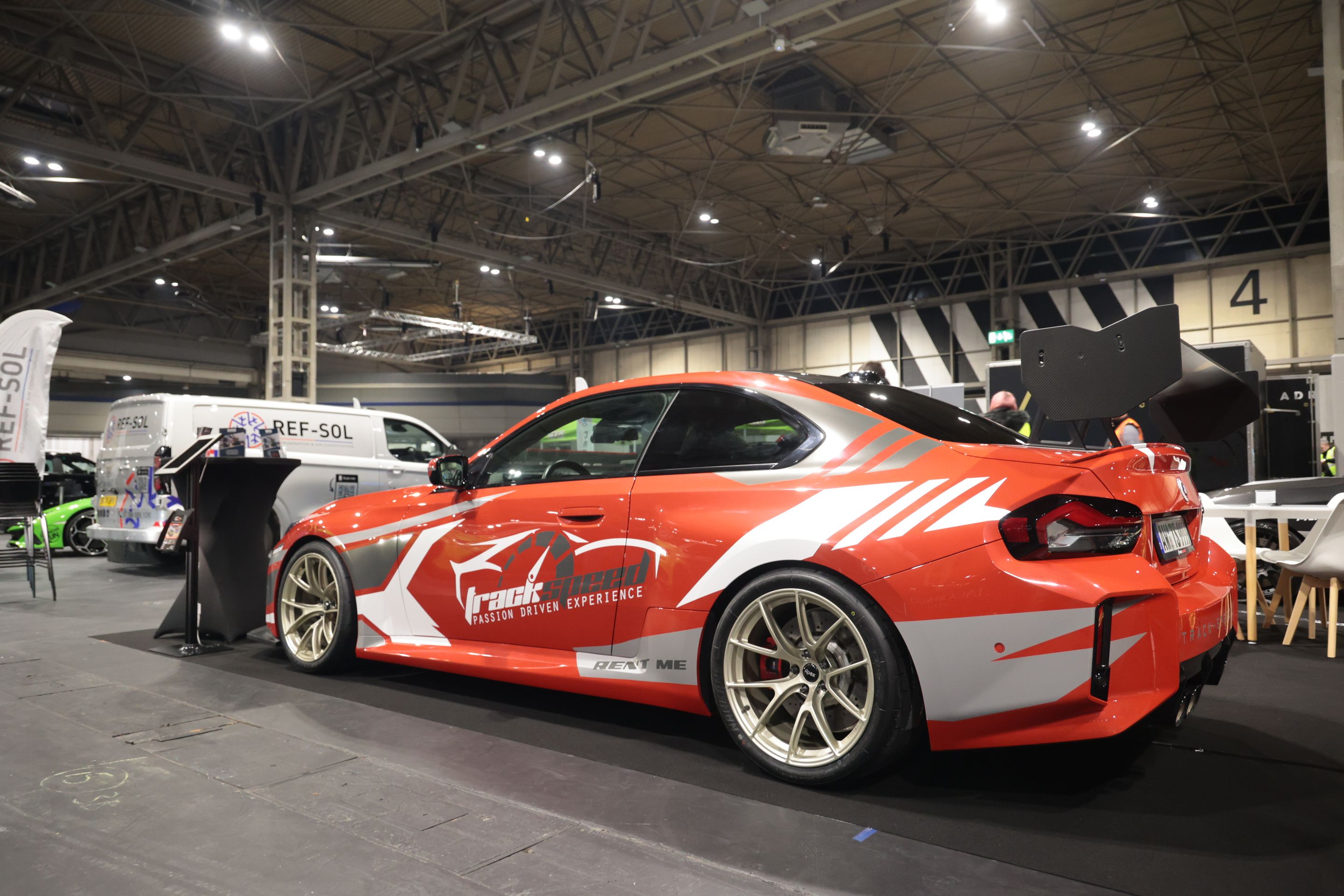 Red BMW G87 M2 with 19" VS-5RS Apex wheels in Motorsport Gold