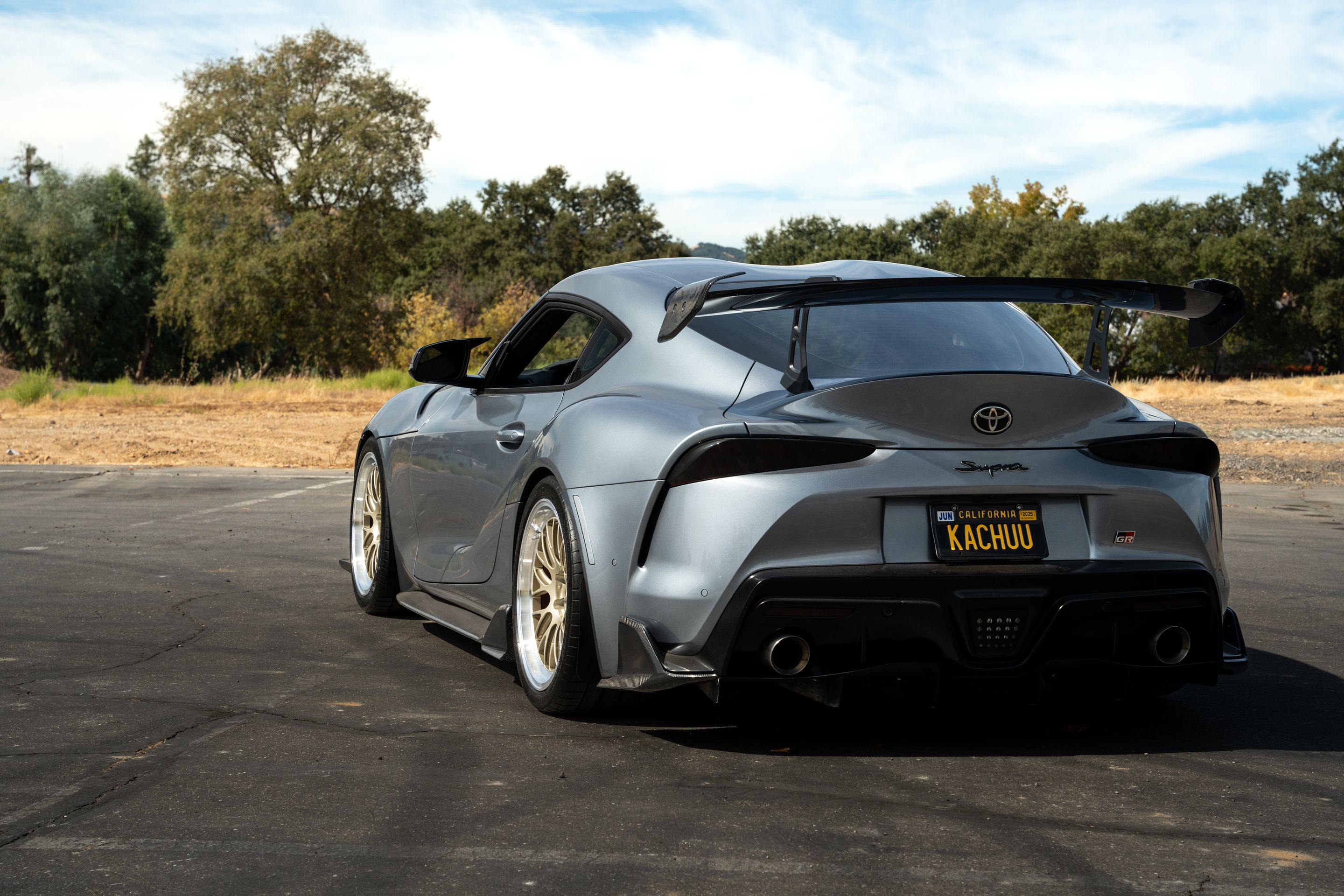 Grey Toyota GR Supra with 19" ML-10RT Apex wheels in Machined Lip Gloss Motorsport Gold