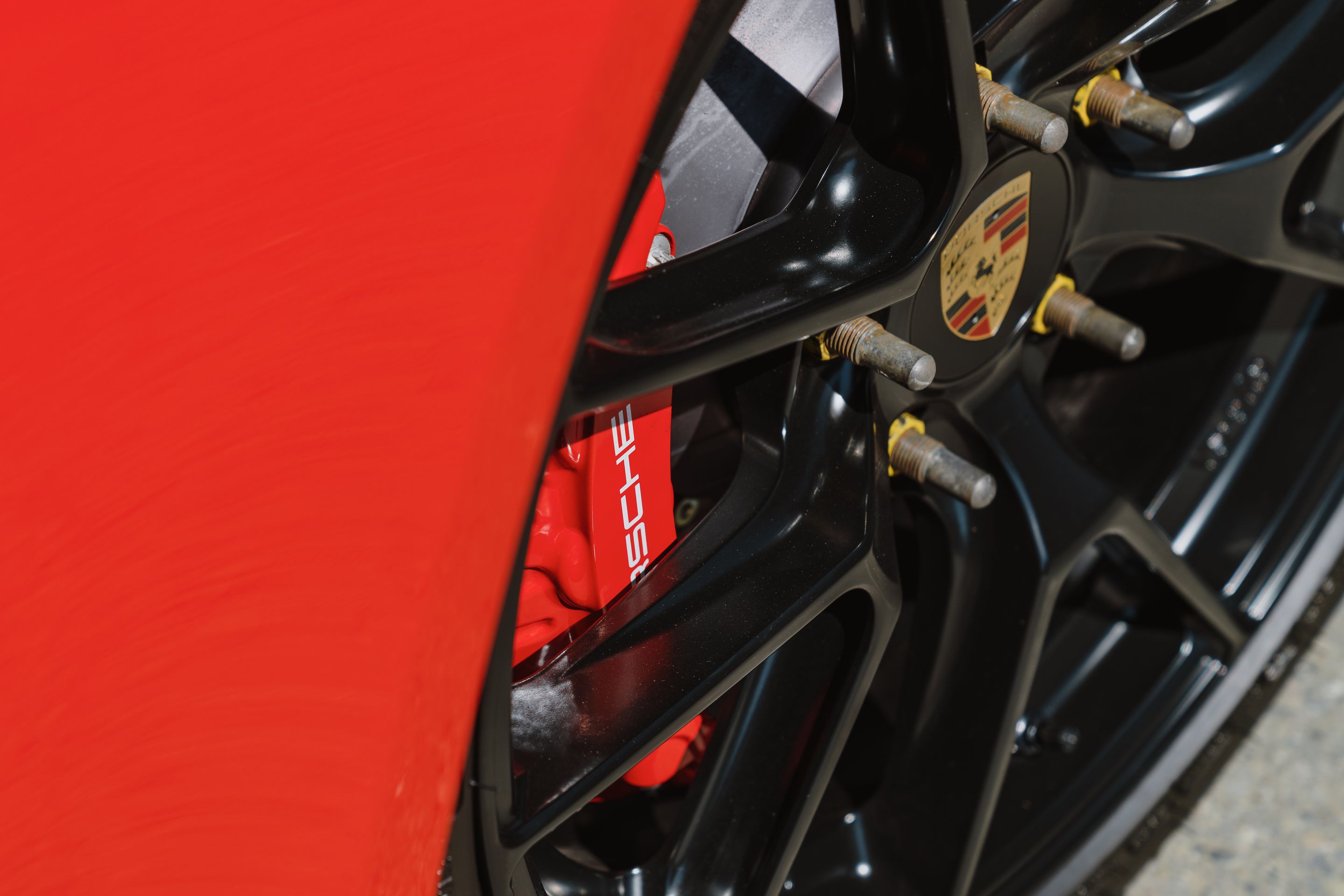 Red Porsche 718 Cayman GT4 with 19" VS-5RS Apex wheels in Satin Black