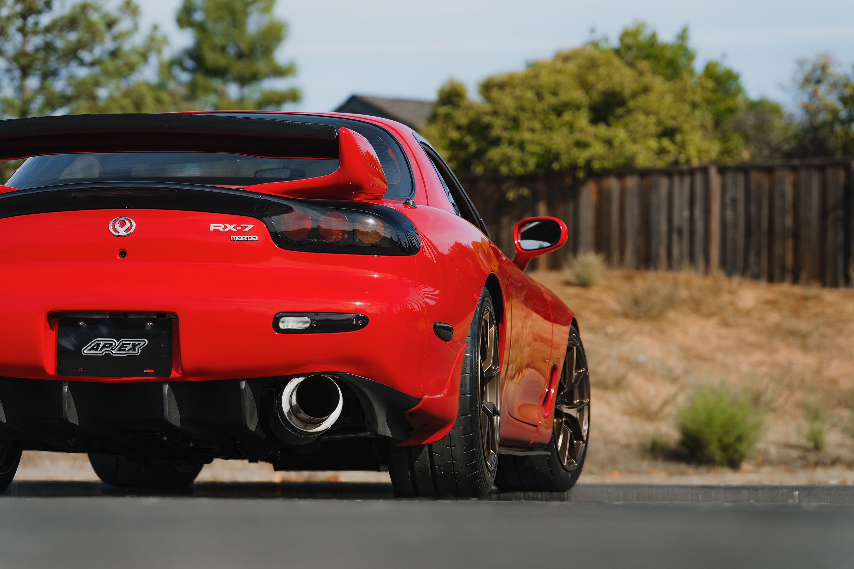 Red Mazda FD RX-7 with 17" VS-5RS Apex wheels in Satin Bronze
