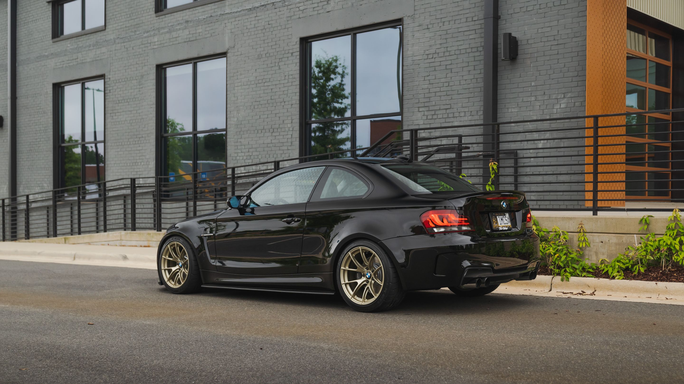 Black BMW E82 Coupe 1 Series with 18" VS-5RS Apex wheels in Motorsport Gold