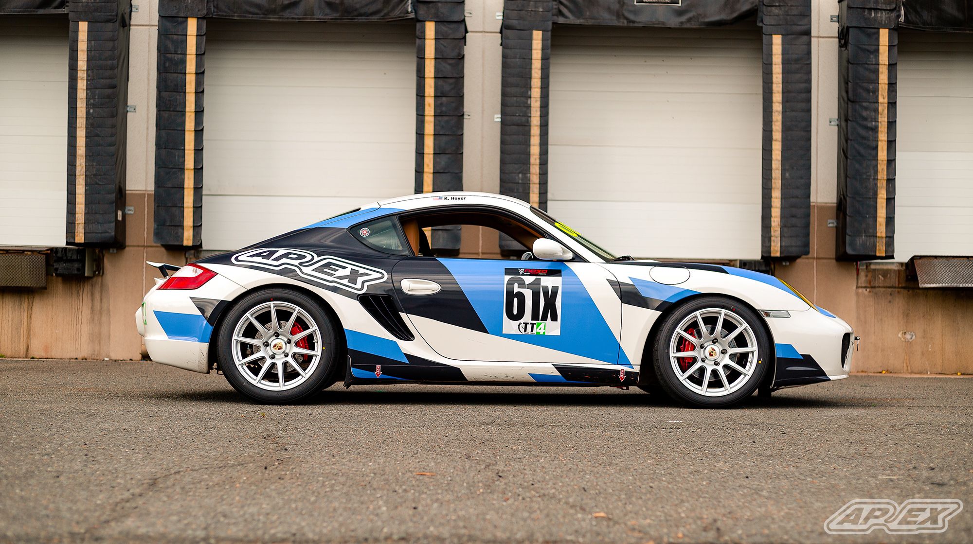 White Porsche 987 Cayman S with 18" SM-10 Apex wheels in Race Silver