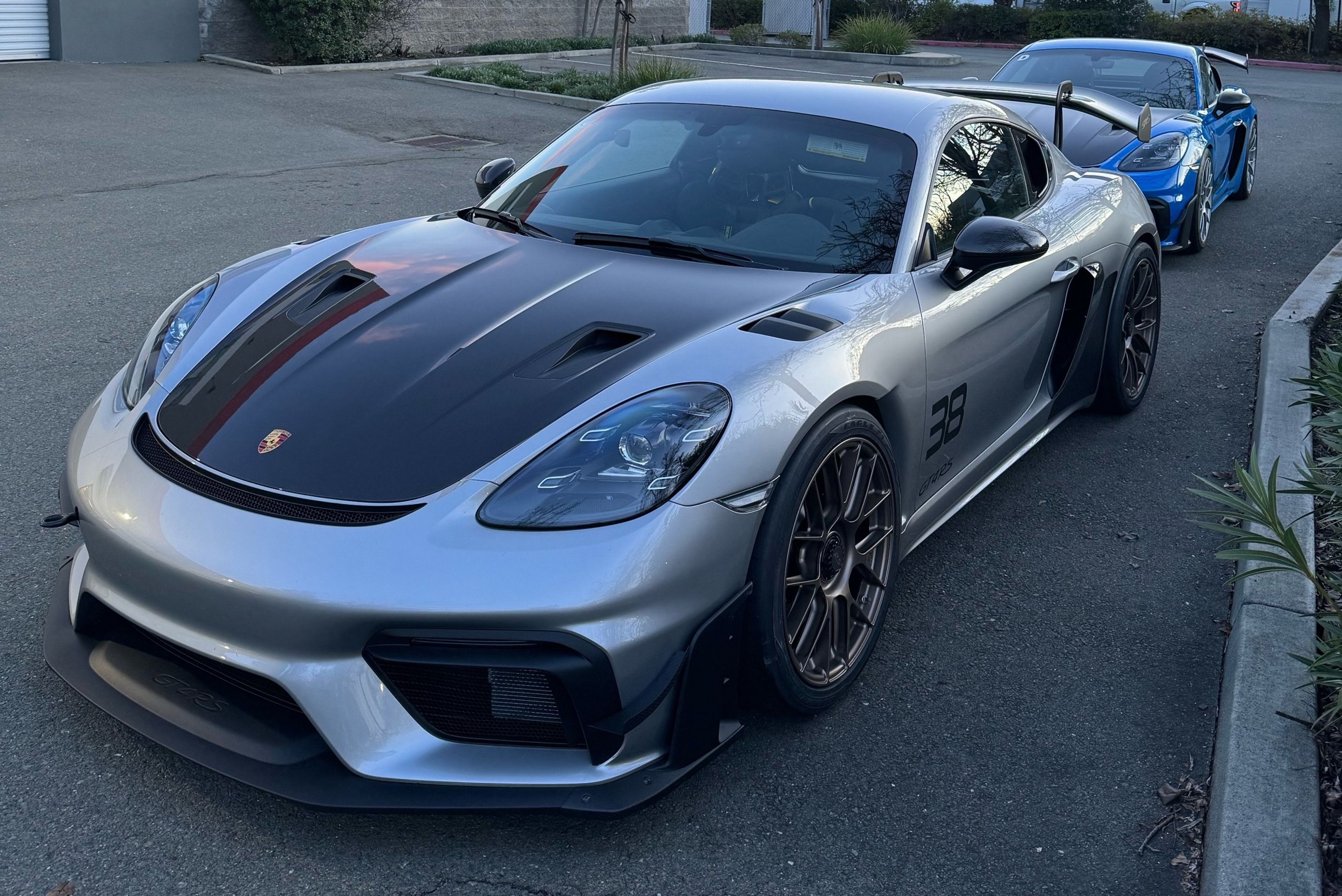 Silver Porsche 718 Cayman GT4 RS with 19" EC-7RS Apex wheels in Custom Finish