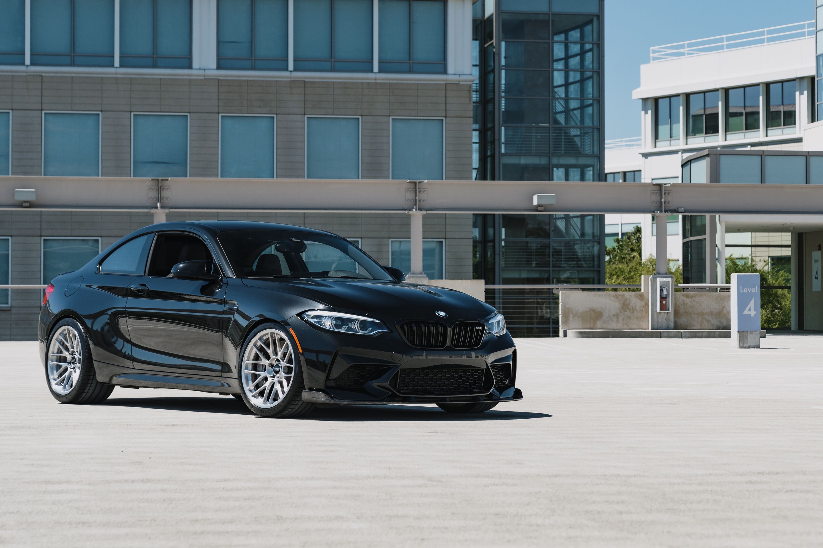 Black BMW F87 M2 with 19" ARC-8RT Apex wheels in Brushed Clear
