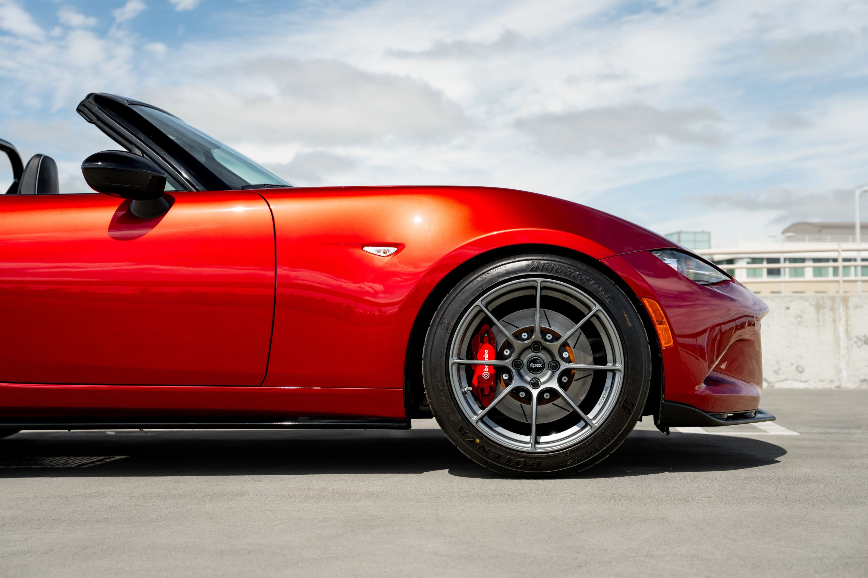 Red Mazda ND MX-5 Miata with 17" SM-8RS Apex wheels in Anthracite