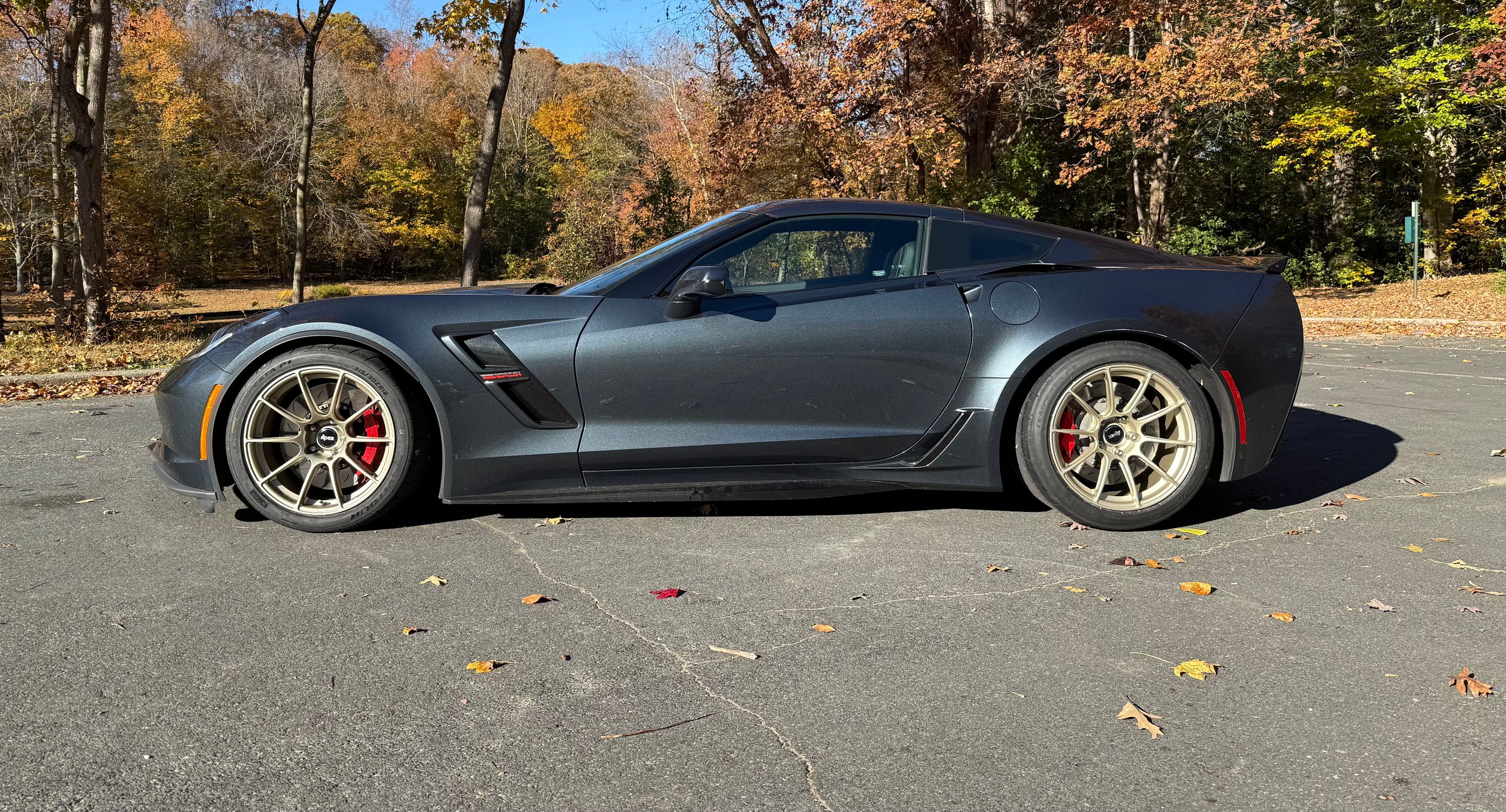 Grey Chevrolet C7 Corvette Grand Sport with 18" SM-10RS Apex wheels in Motorsport Gold