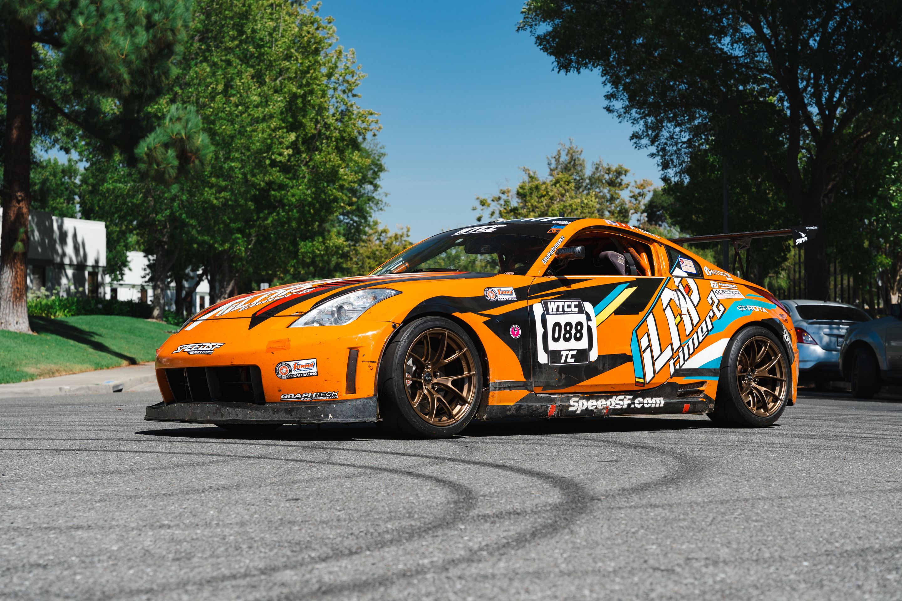 Orange Nissan 350Z with 18" VS-5RS Apex wheels in Satin Bronze