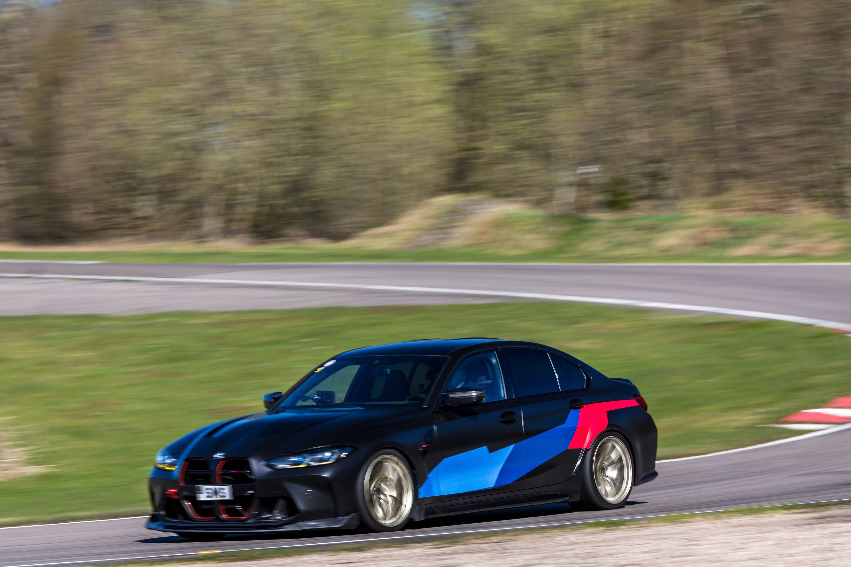 Black BMW G80 M3 with 19" VS-5RS Apex wheels in Motorsport Gold